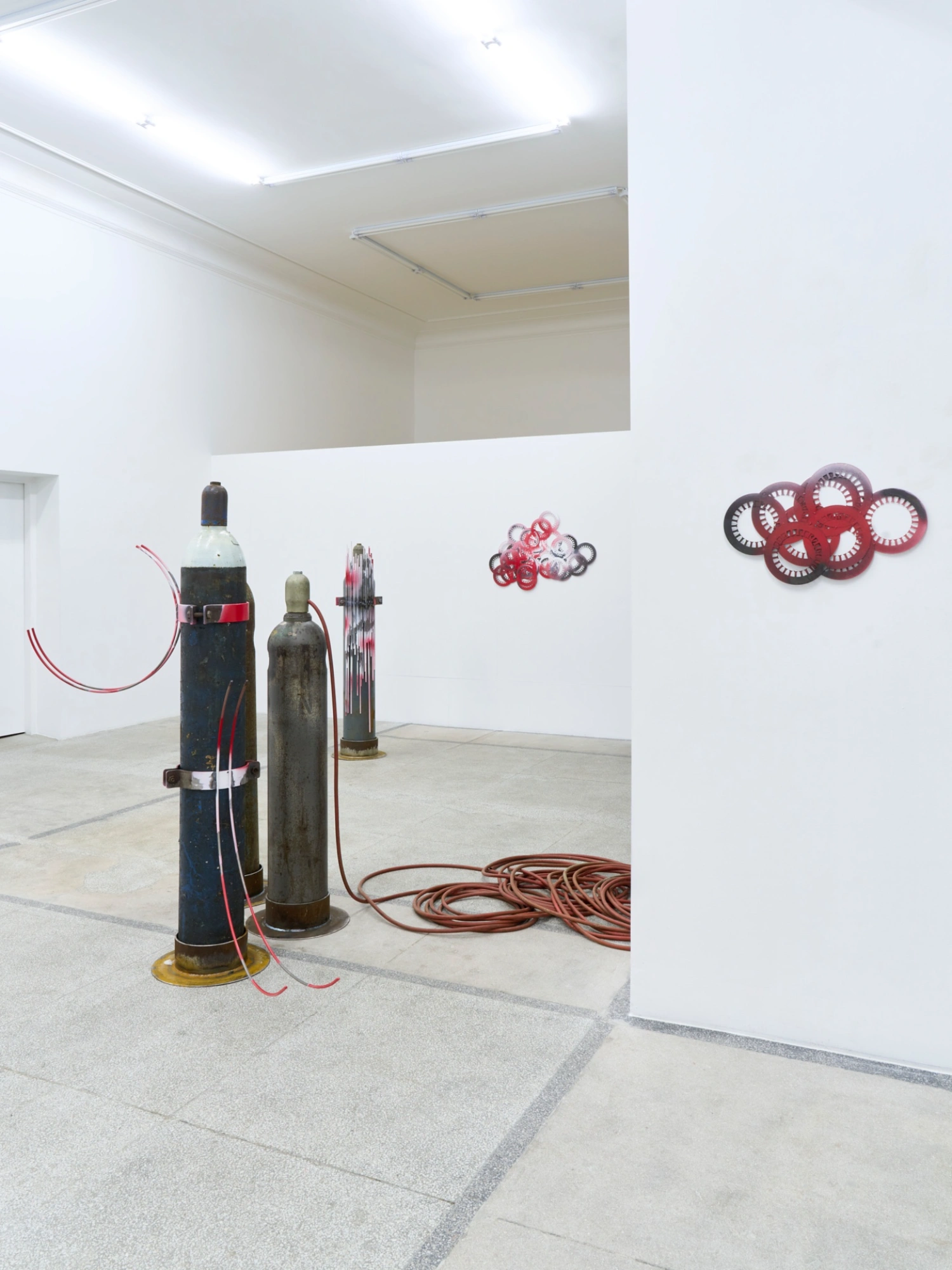 Swarm / Rój by Zuza Golinska at Piktogram — Golinska's installation pairs grounded industrial forms with suspended geometric constructs.