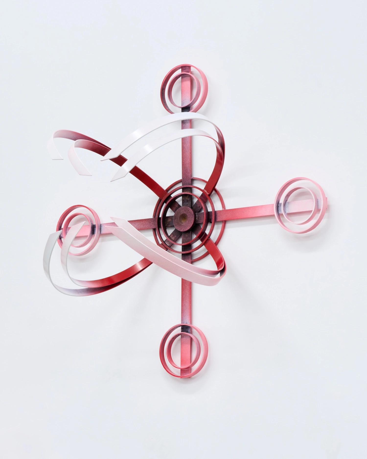 Swarm / Rój by Zuza Golinska at Piktogram — Golinska's sculptural installation employs nested circular wire forms in graduated pink and red tones, suspended against a white gallery wall.