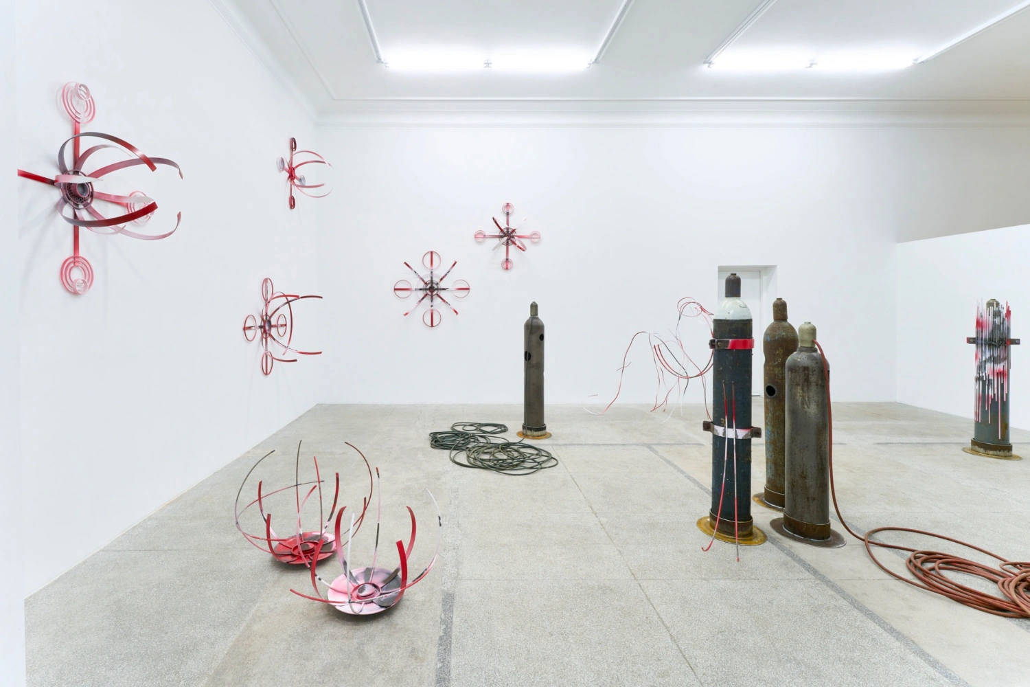 Swarm / Rój by Zuza Golinska at Piktogram — Zuza Golinska's installation occupies a white gallery interior with fluorescent ceiling panels.