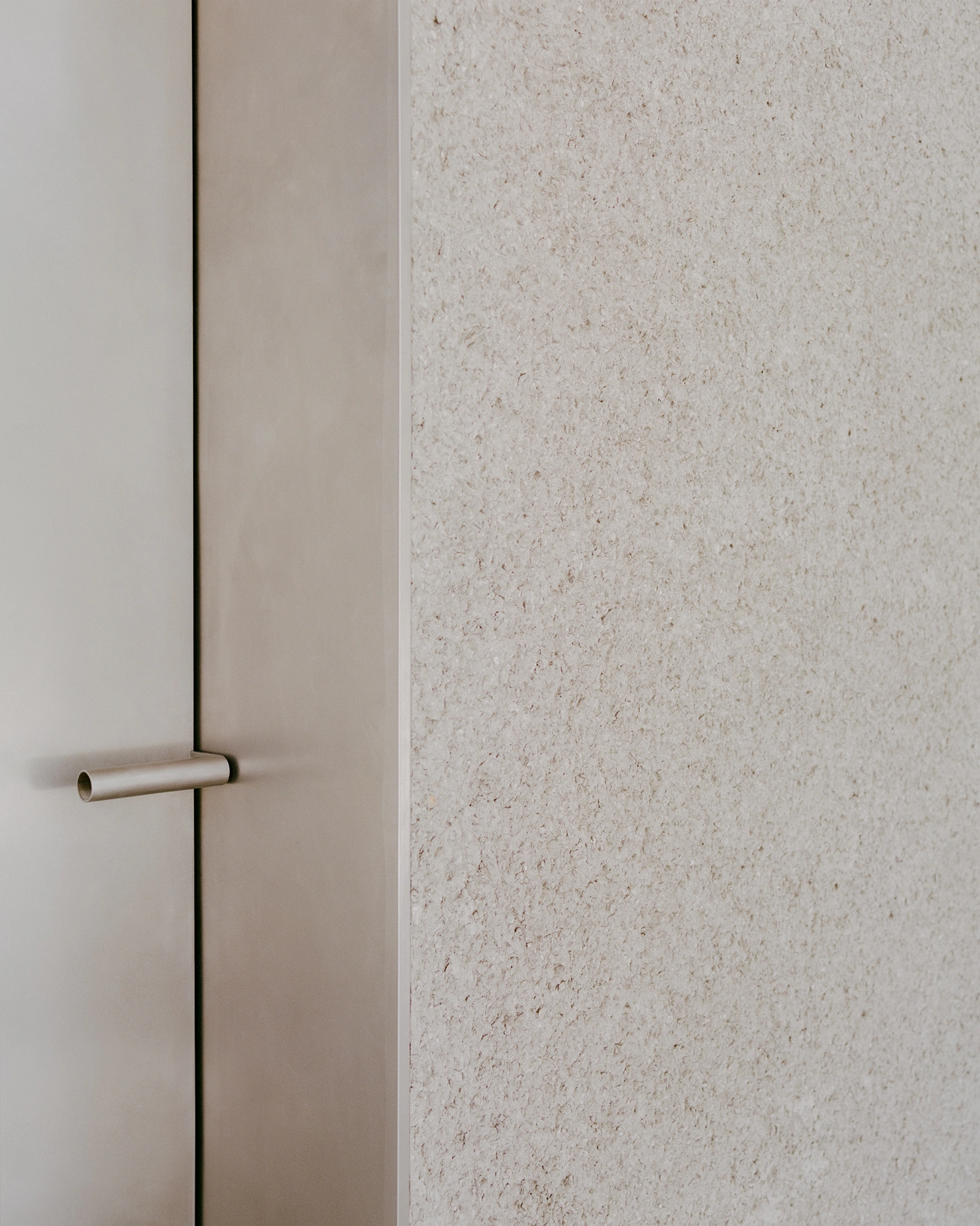 K-Auction Exhibition Hall Sinsa by min_workshop + 3ab — A threshold detail from K-Auction's Seoul exhibition hall reveals the material palette defining the 2,500-square-meter venue.