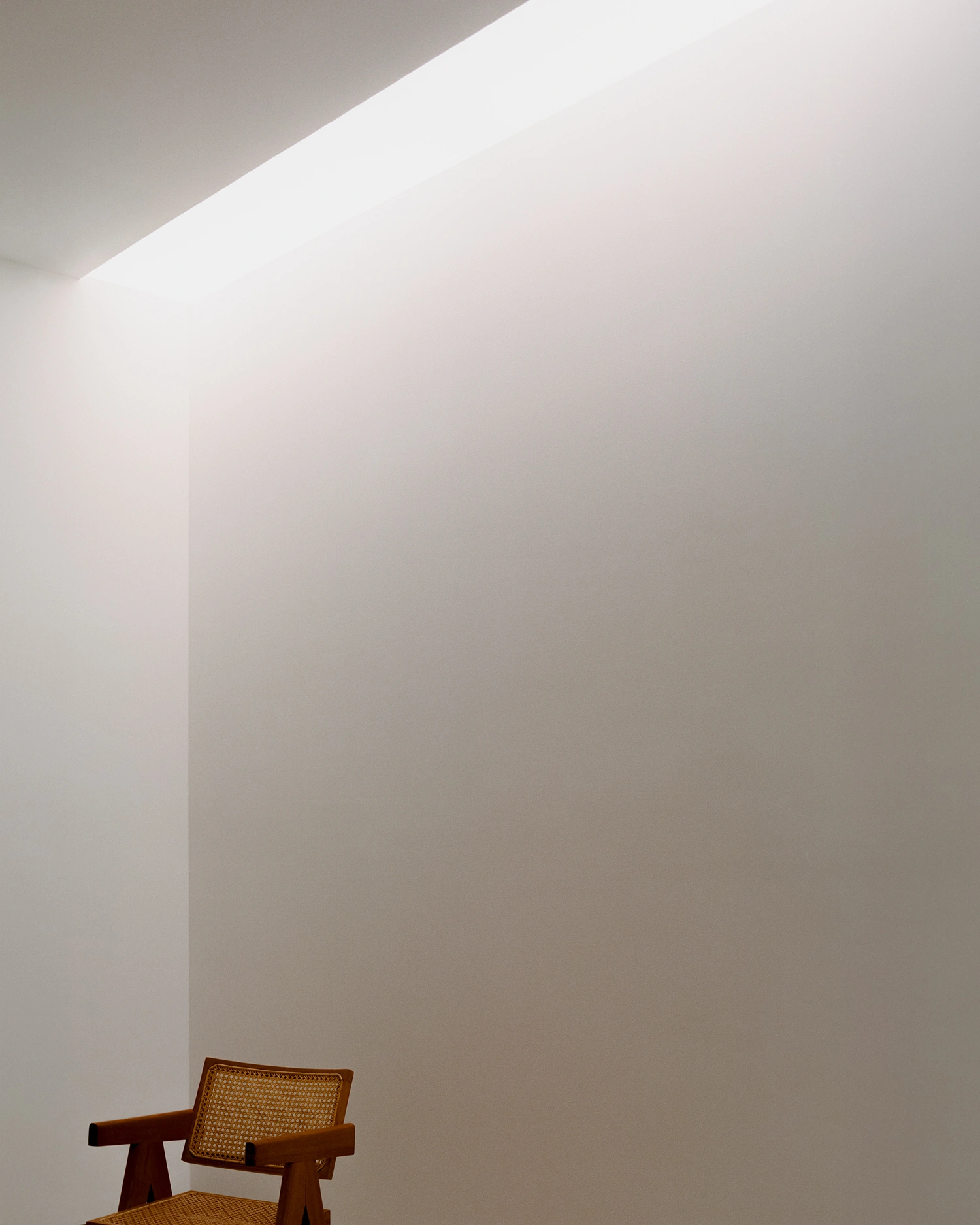 K-Auction Exhibition Hall Sinsa by min_workshop + 3ab — A minimalist interior passage demonstrates the exhibition hall's restrained material palette and spatial clarity.