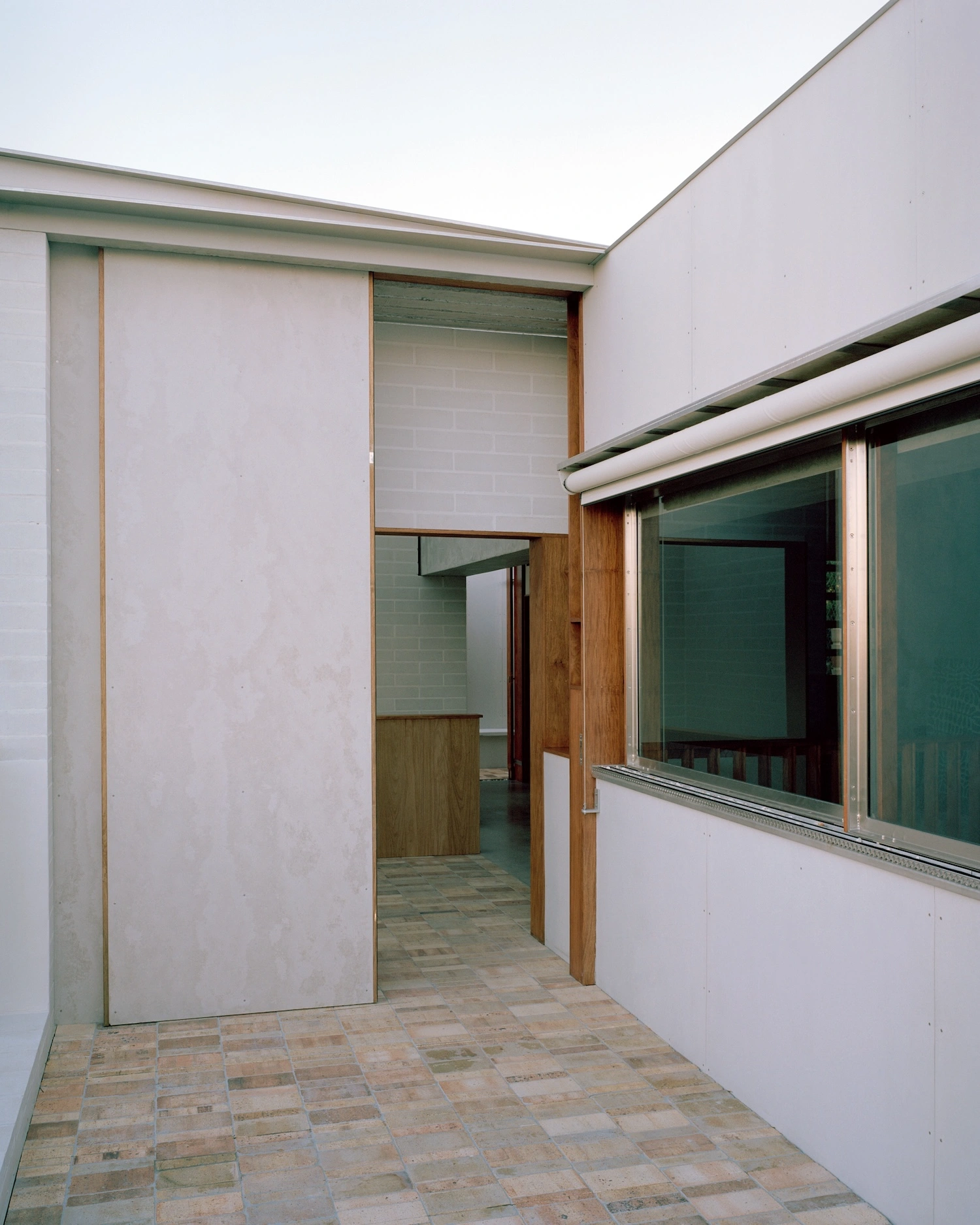 Birdwood House by Peter Besley — A passage through reclaimed materials and modulated light.