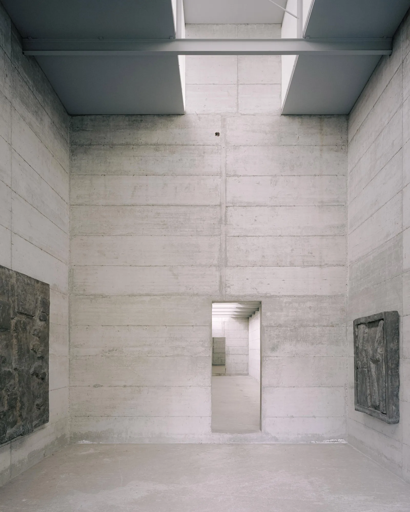 La Congiunta Museum by Peter Märkli — A processional corridor in concrete showcases Hans Josephsohn's sculptural works mounted on the side walls.