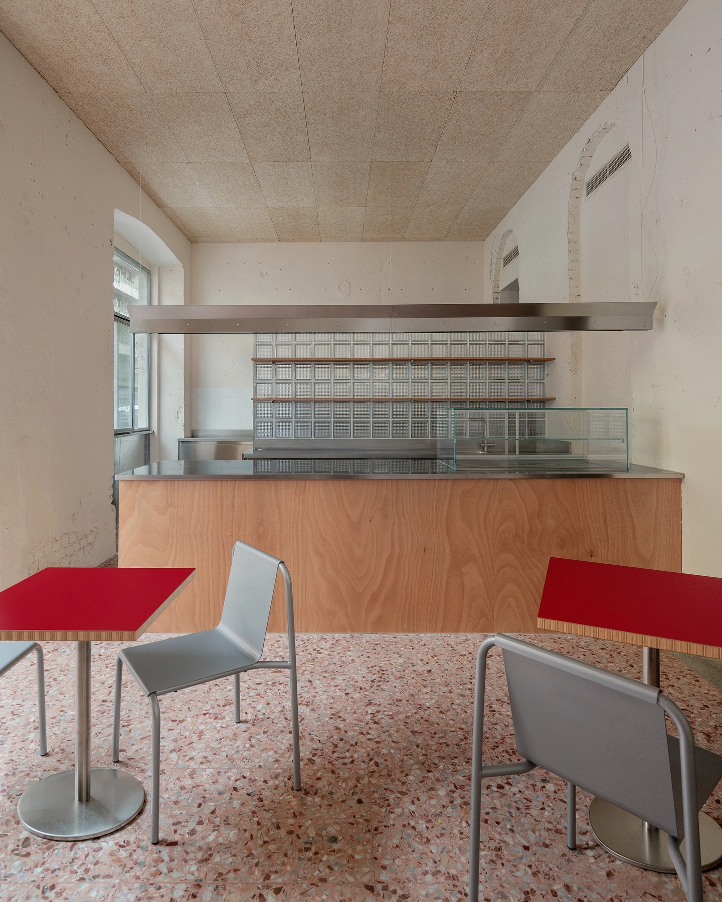 L’ALTRO by Sagoma Studio — A compact commercial interior demonstrates essentialist spatial design through restrained material palettes and functional clarity.
