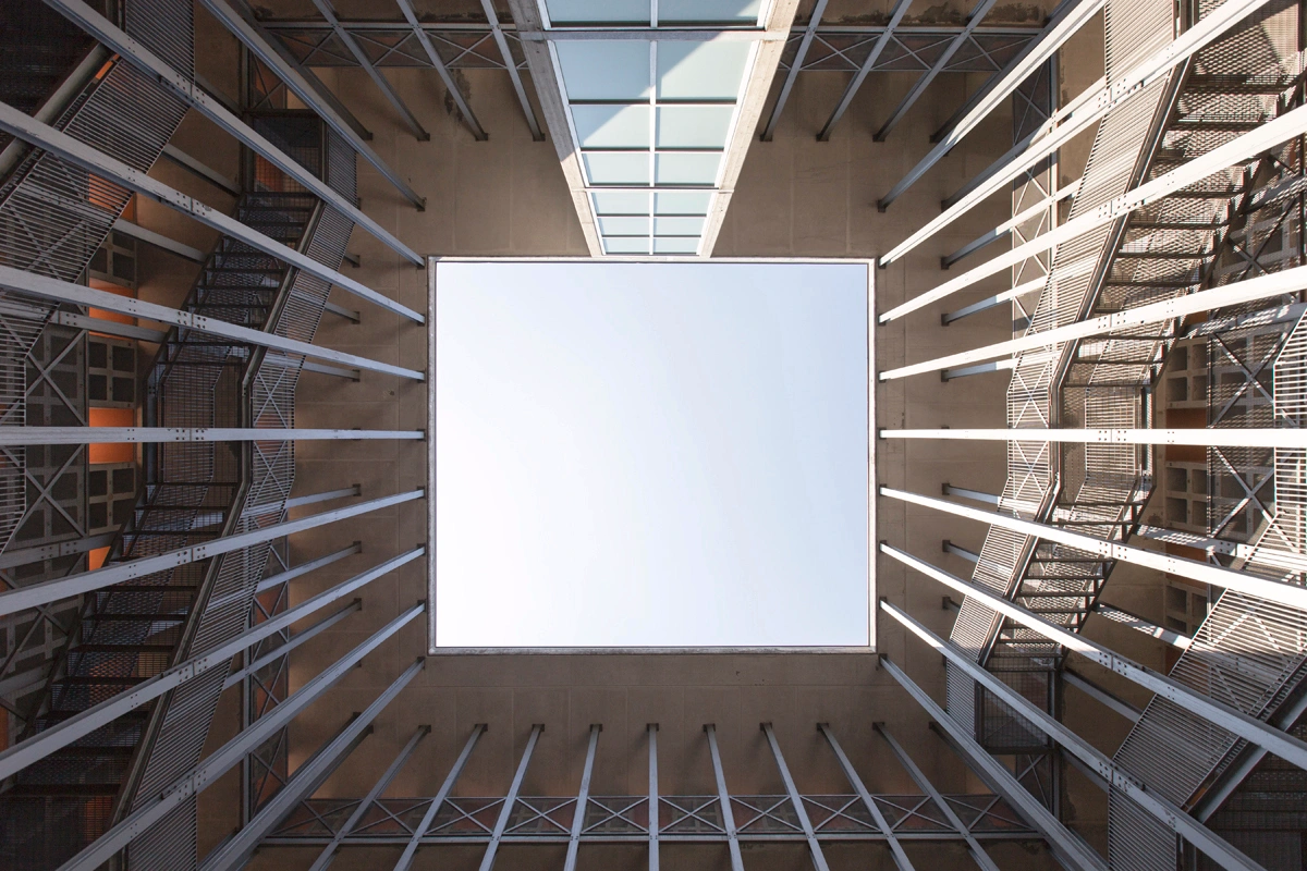 San Cataldo Cemetery by Aldo Rossi — Overhead perspective of San Cataldo Cemetery's courtyard void, framed by four identical brick facades.