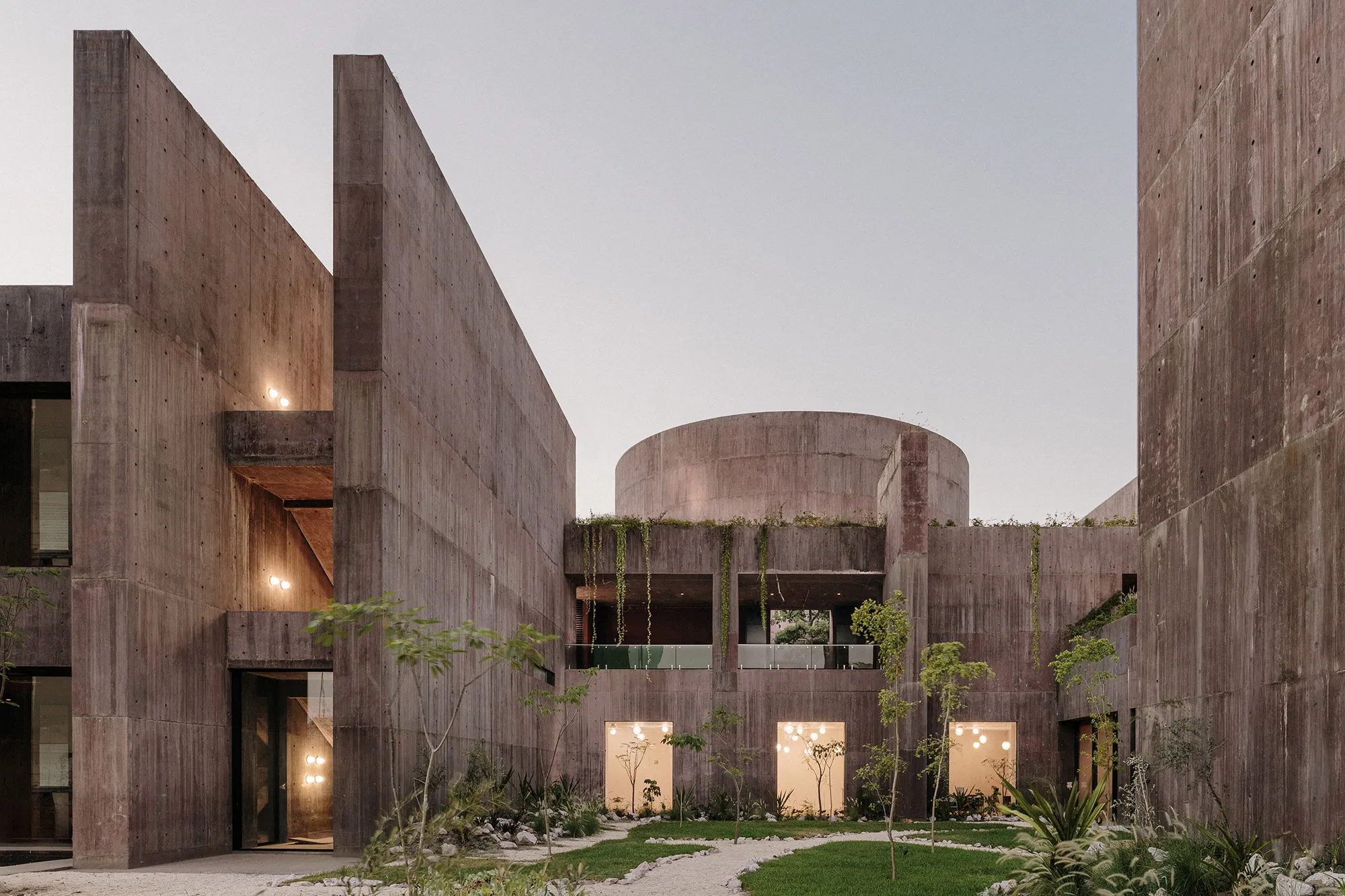 Sea of Cortez Research Center by Tatiana Bilbao — The Sea of Cortez Research Center's courtyard reveals its board-formed concrete construction through weathered pigmented walls bearing visible formwork...