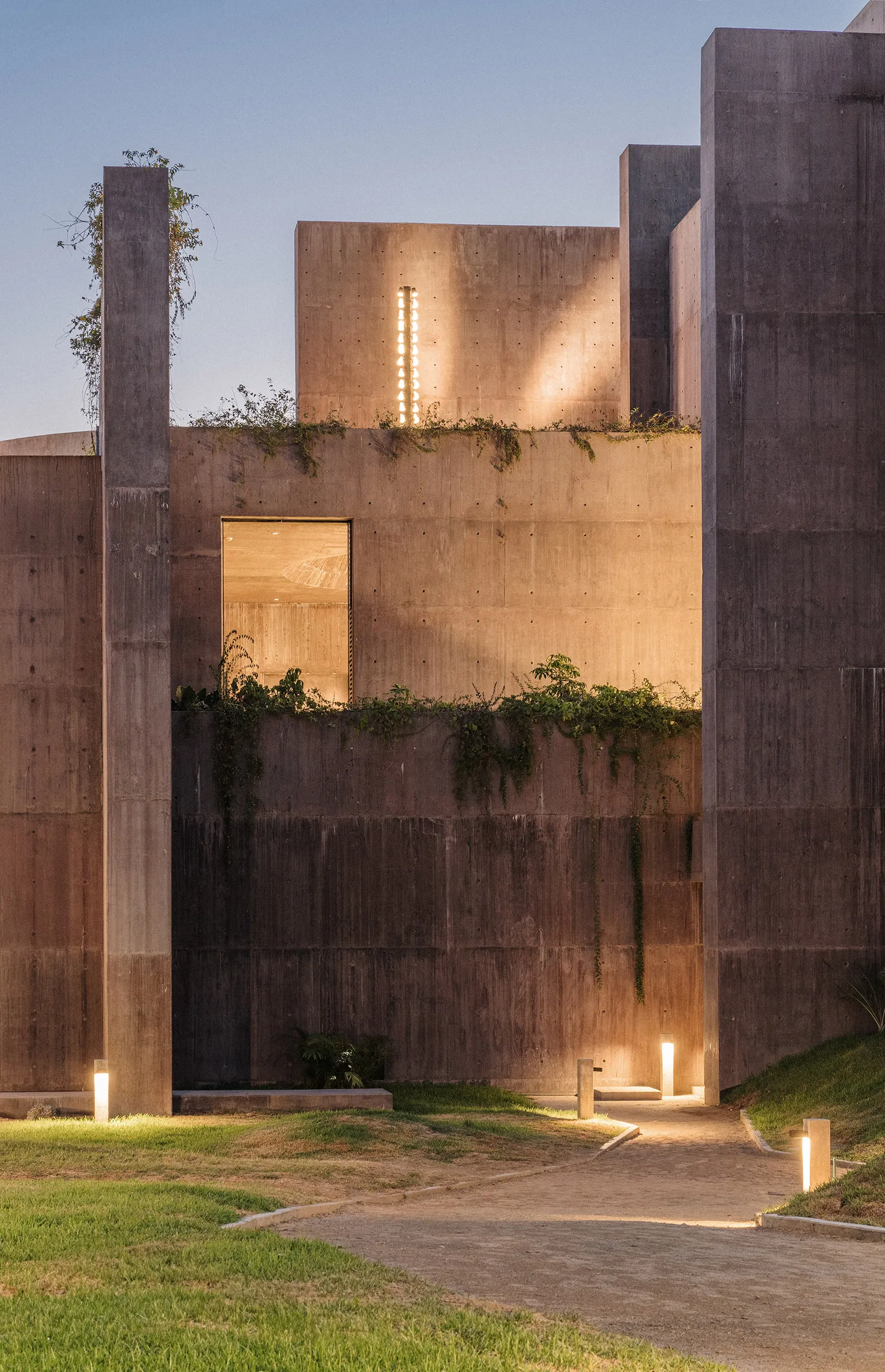Sea of Cortez Research Center by Tatiana Bilbao — The research center's primary facade presents a monolithic concrete composition illuminated in golden-hour light.