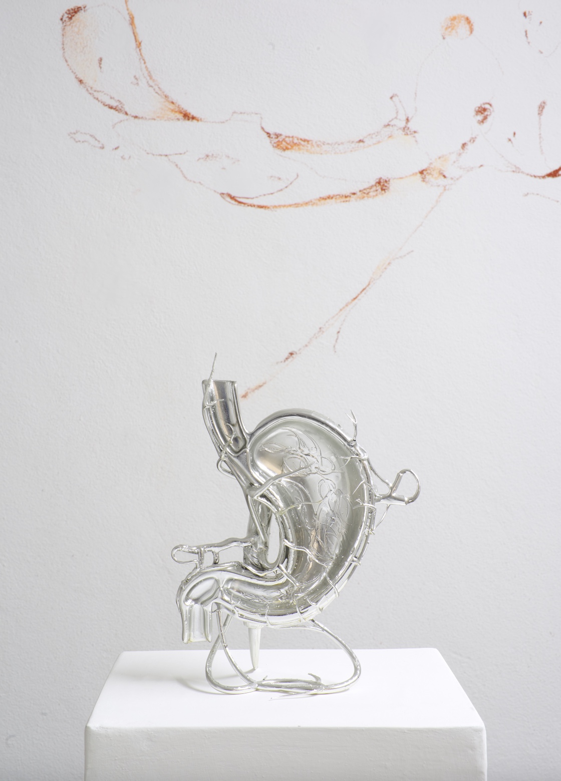 Opacity As A Healing Space by Szilvia Bolla Lorenzo Conforti at Limbo Contemporary — A translucent resin stomach form occupies the white plinth, its surface revealing internal anatomical detail rendered in cast relief.