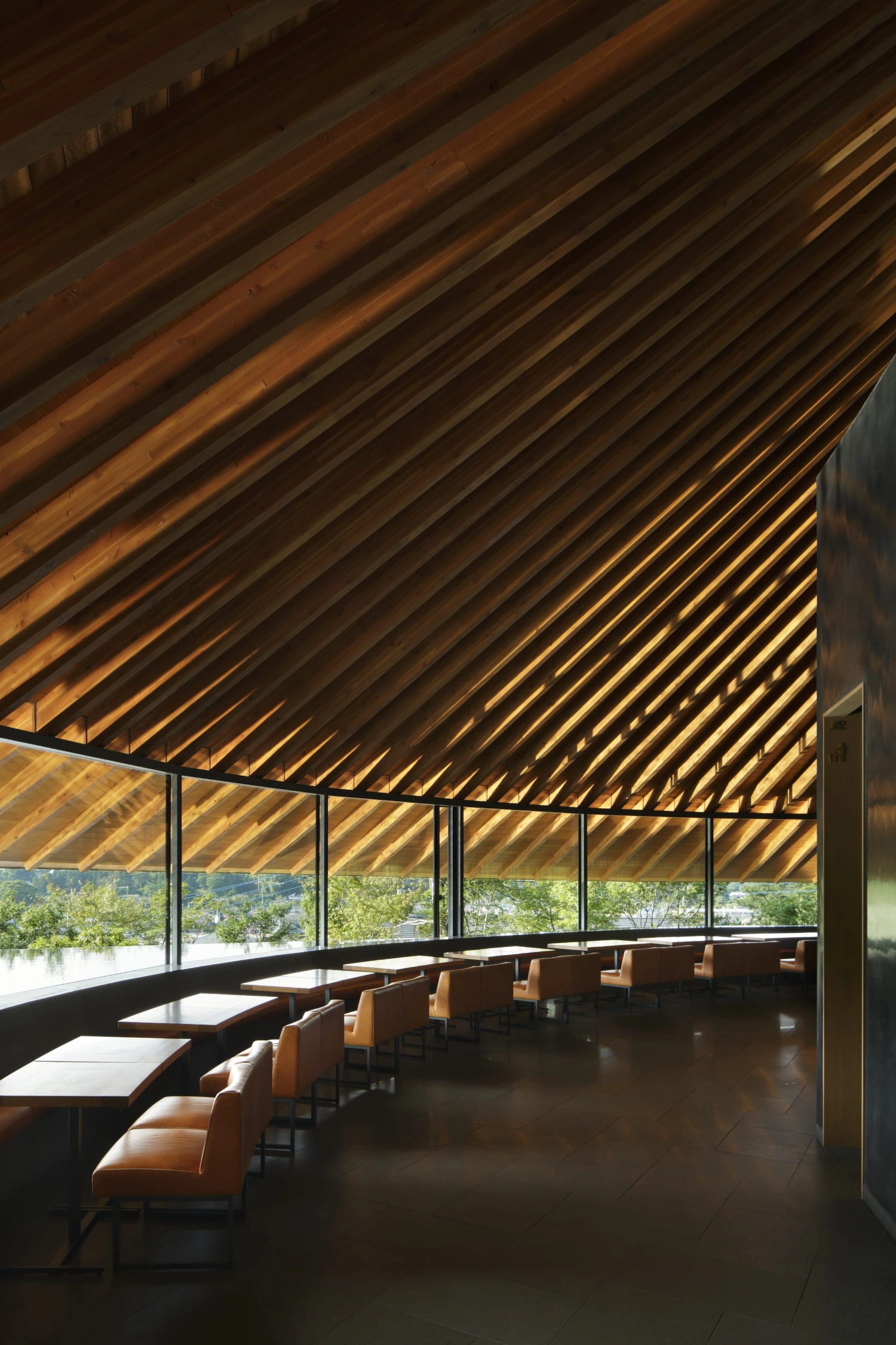 Sayama Lakeside Cemetery Community Hall by Hiroshi Nakamura & NAP — The community hall's interior presents a studied exercise in geometric restraint.