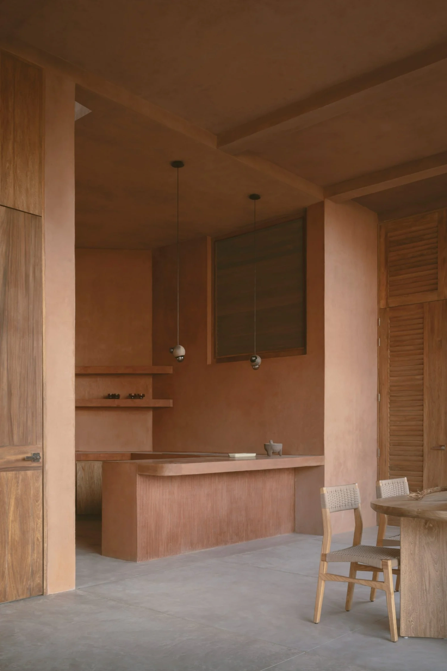 Casa Tobi by Espacio 18 Arquitectura — Interior view of Casa Tobi's kitchen and dining area, showcasing the home's material restraint and geometric clarity.