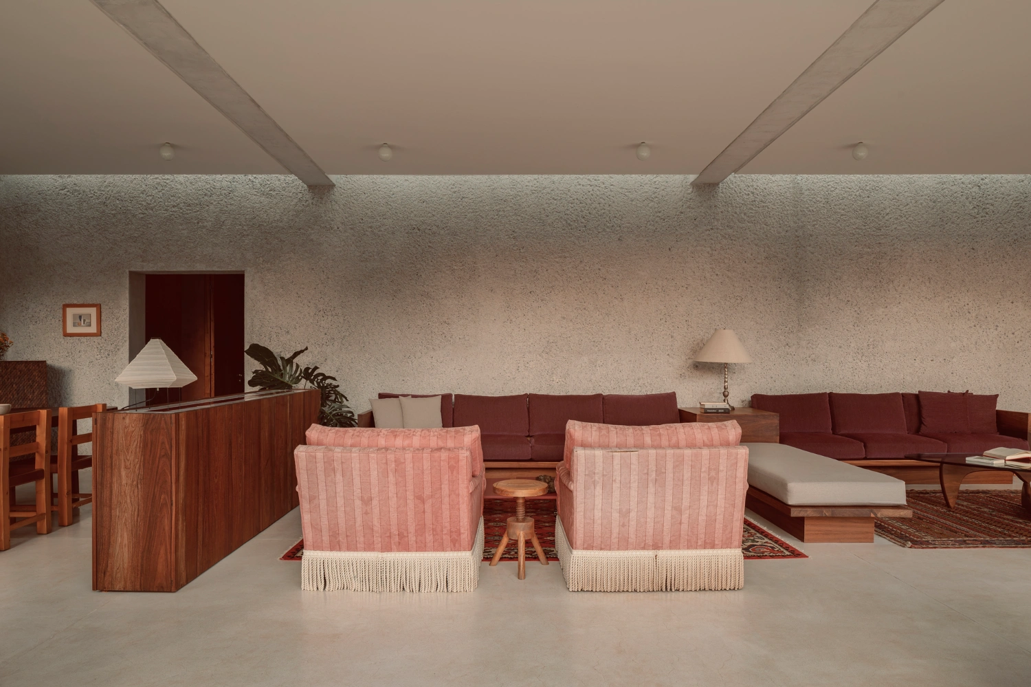 House Between Two Rivers by Taller 3000 — An interior view of the shared living space reveals the house's material and spatial organization.