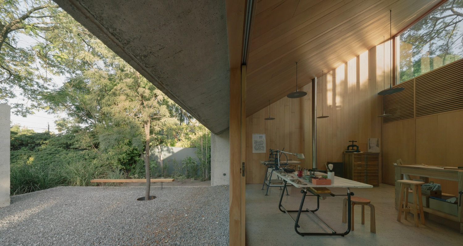 Atelier Workshop by Agustín Berzero — The interior workshop establishes a working threshold between built form and landscape.