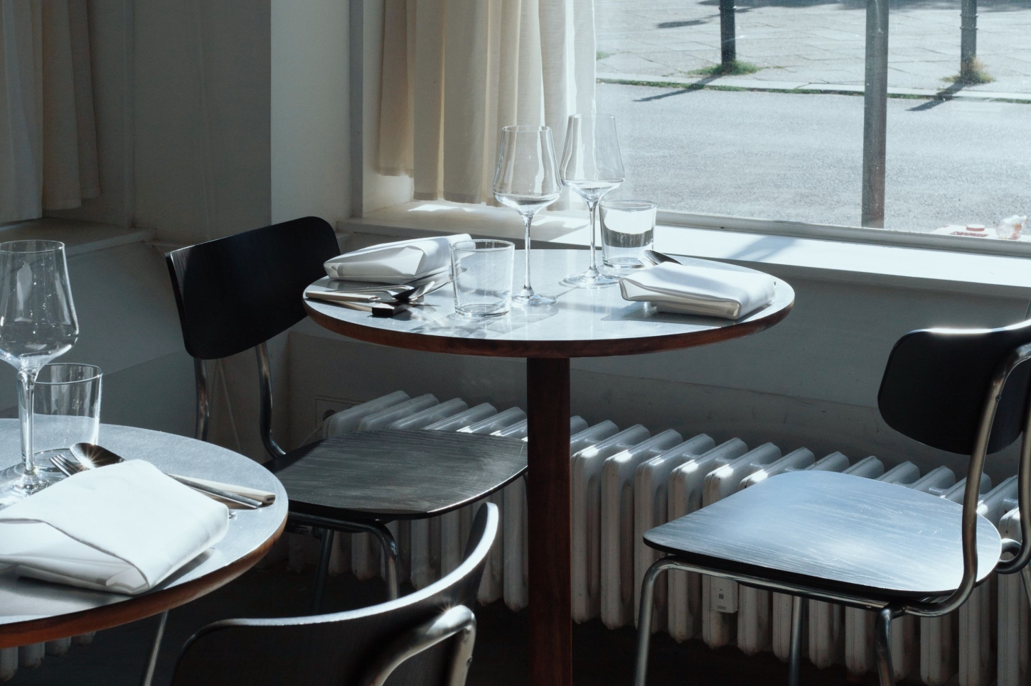 Julius in Berlin — A dining room corner at Julius captures the restaurant's commitment to material clarity and spatial restraint.
