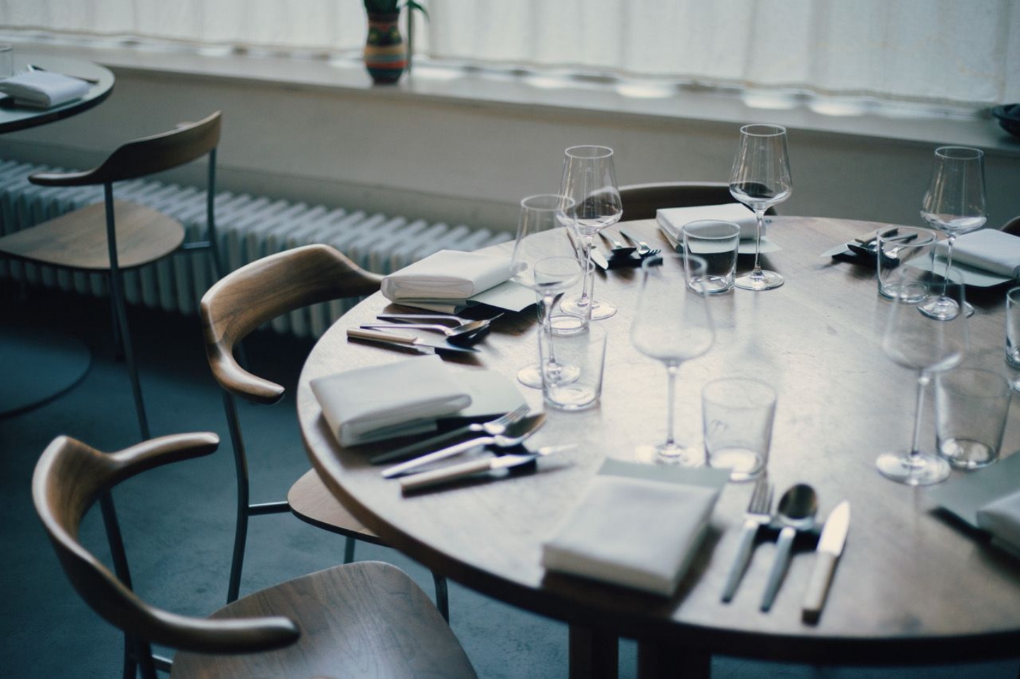 Julius in Berlin — A dining table set for service demonstrates Julius's commitment to clarity and materiality.