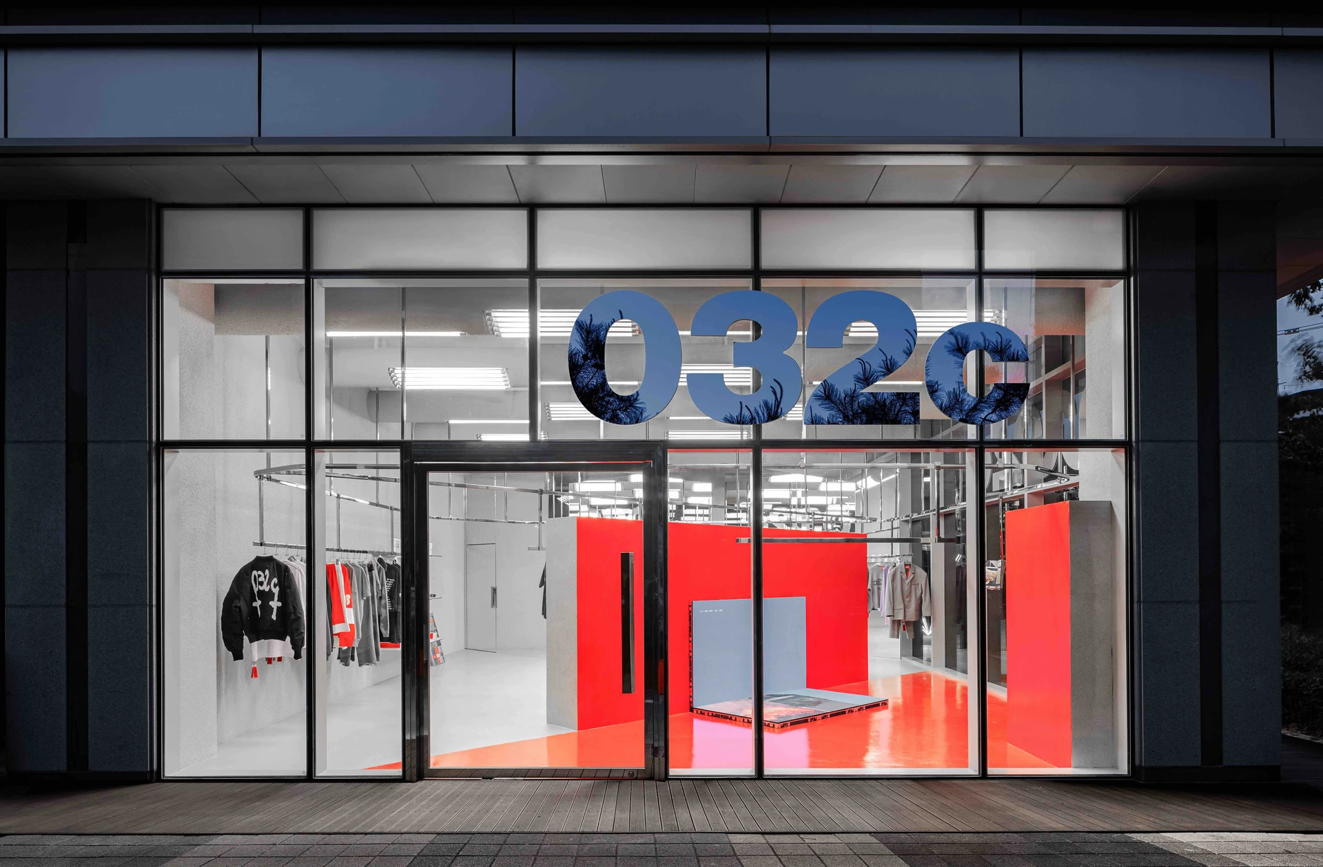 032c Gallery in Seoul by Gonzales Haase AAS — The Seoul flagship of Berlin-based 032c opens onto a polished concrete threshold, its black-framed glass storefront anchoring a street facade.