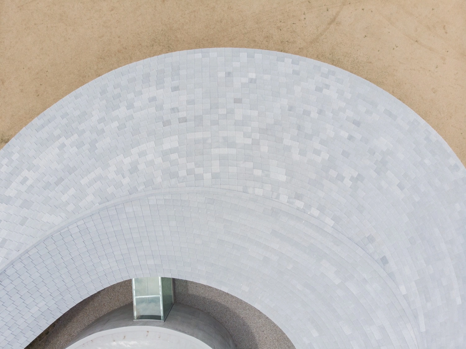 Yashima Mountaintop Park by SUO + Style-A — Overhead view of the white concrete ribbon's interior curve, revealing the geometric precision of board-formed construction.