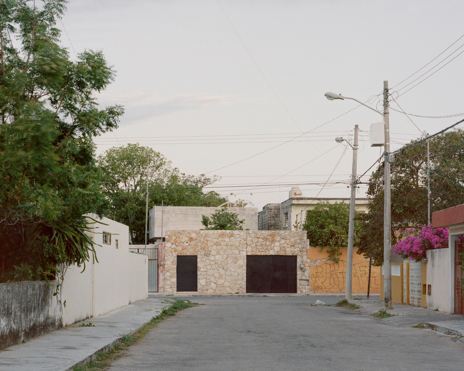 House in Los Cocos by Ludwig Godefroy Architecture — A narrow street frontage in Mérida reveals the House in Los Cocos's measured architectural response to a constrained plot.