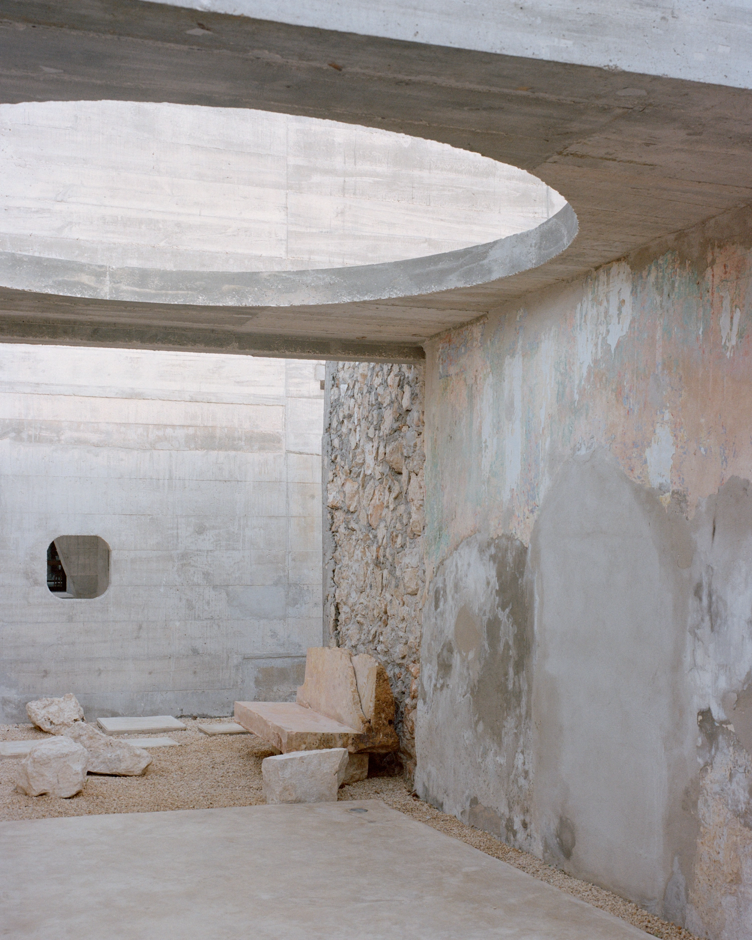 House in Los Cocos by Ludwig Godefroy Architecture — A concrete pavilion interior showcases the project's spatial choreography through layered structural elements.