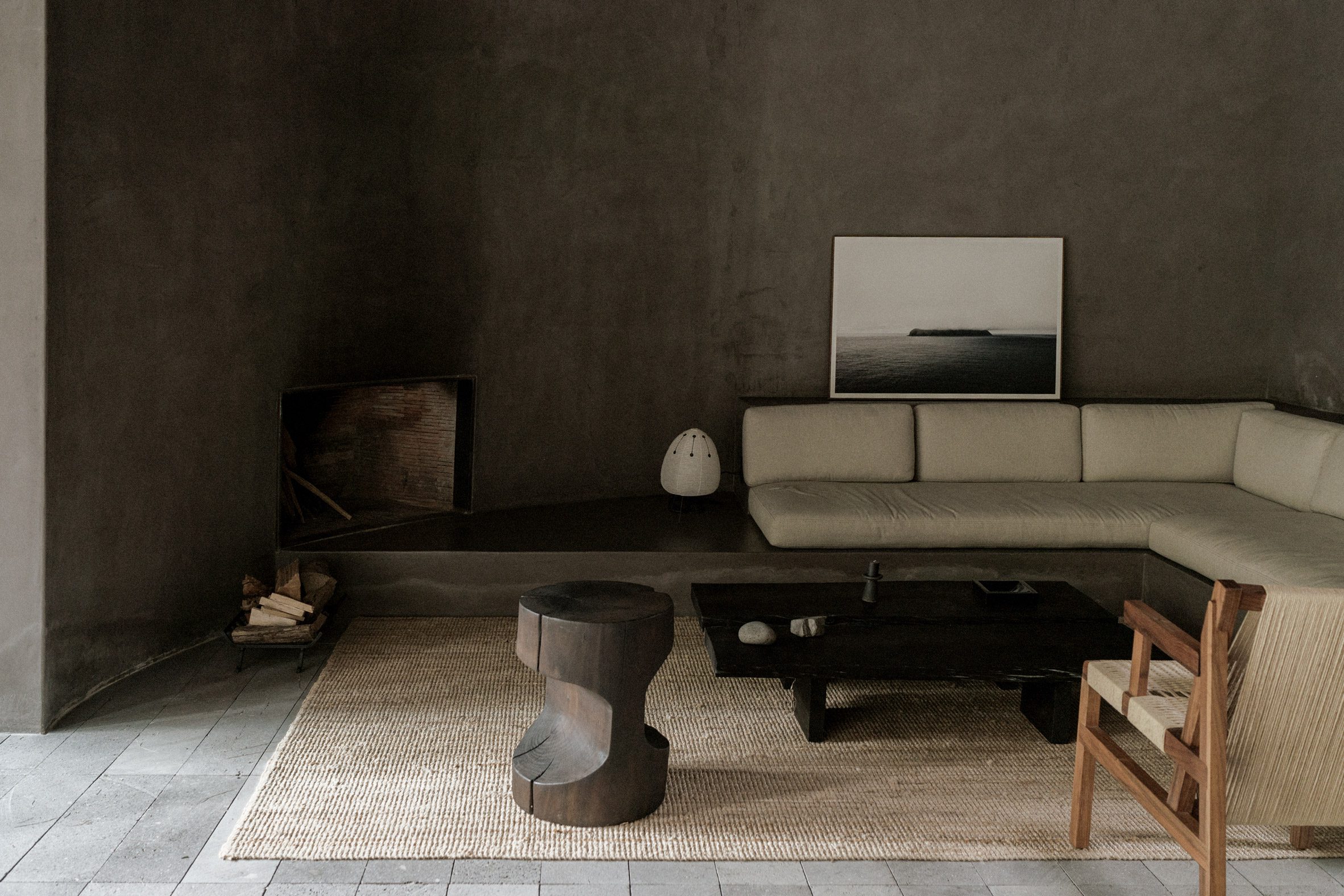 Copas House by PPAA — Interior view of Copas House featuring a monolithic concrete platform with raw, board-formed surfaces and visible formwork texture.
