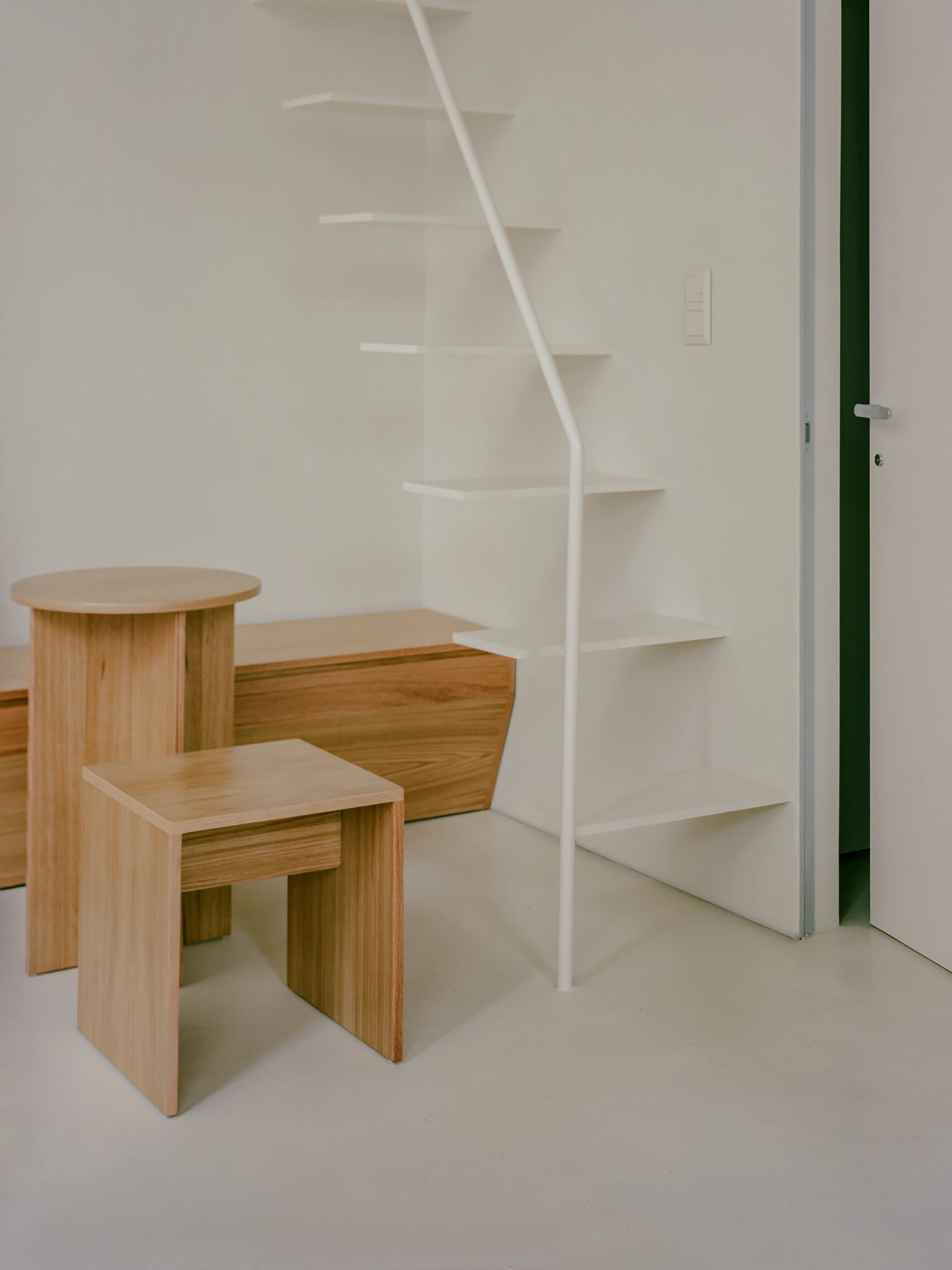 Moden Café by Georgios Apostolopoulos — A sectional view of Moden Café's interior reveals the spatial relationship between bespoke oak furniture and the gallery-like display system.