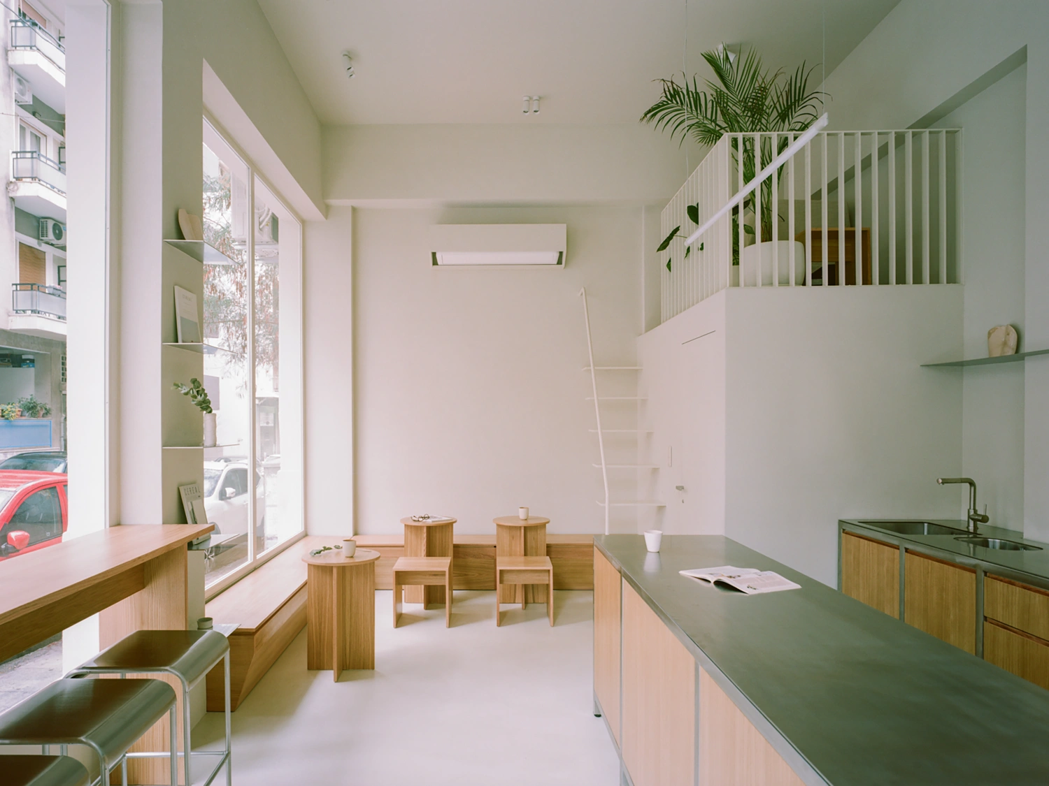 Moden Café by Georgios Apostolopoulos — Moden Café's interior unfolds as a spare, light-filled ground-floor space defined by material restraint and spatial clarity.