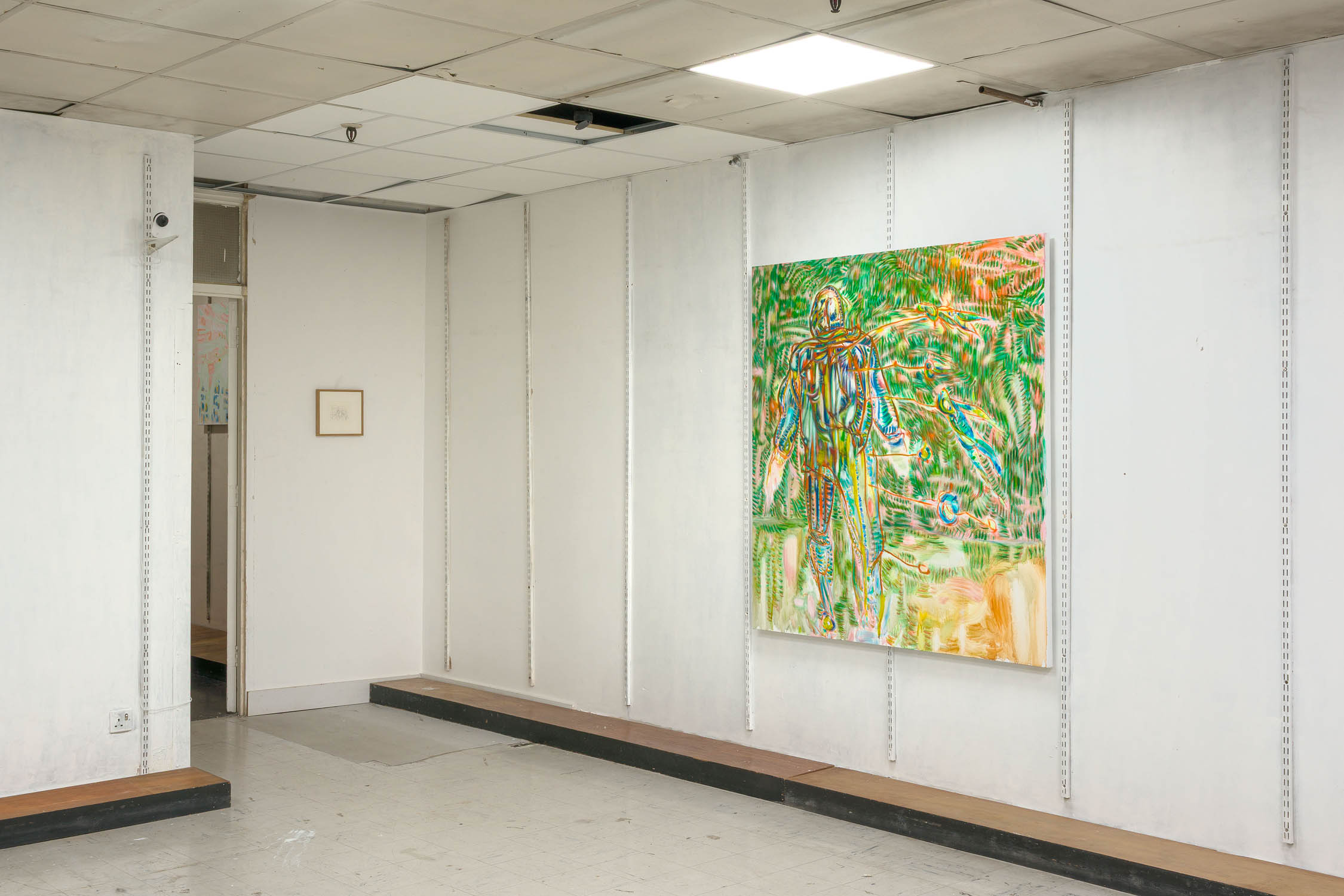 By a ciphered fall by Achraf Touloub at Public Gallery — A densely patterned mixed-media painting dominates the white wall of Public Gallery's raw interior space.