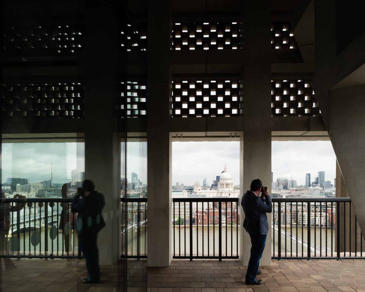 The Tate Modern by Herzog & de Meuron — From the Tate Modern's upper-level viewing platform, visitors frame St.