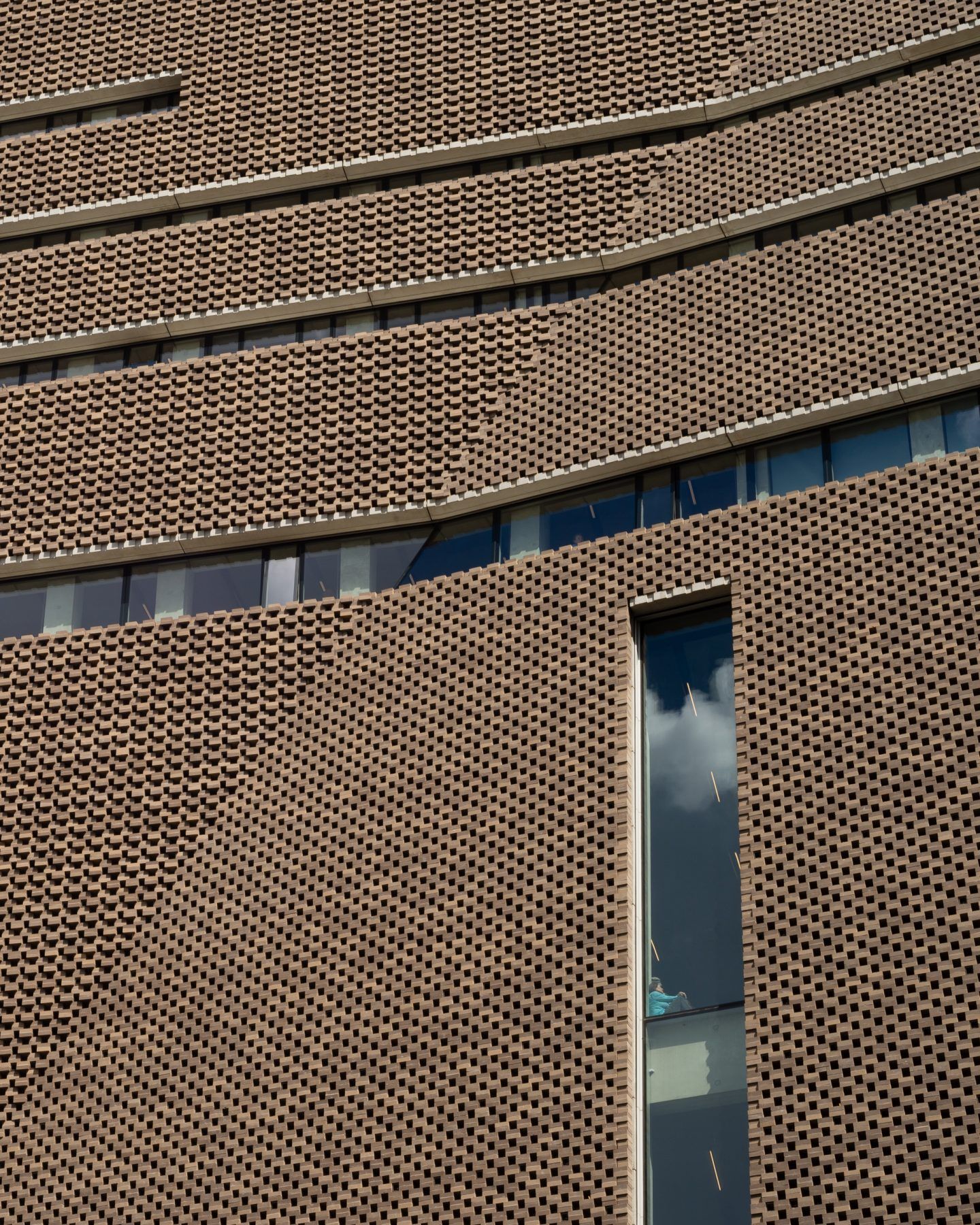 The Tate Modern by Herzog & de Meuron — A close-up view of the Tate Modern's brick facade emphasizes Herzog & de Meuron's material restraint.