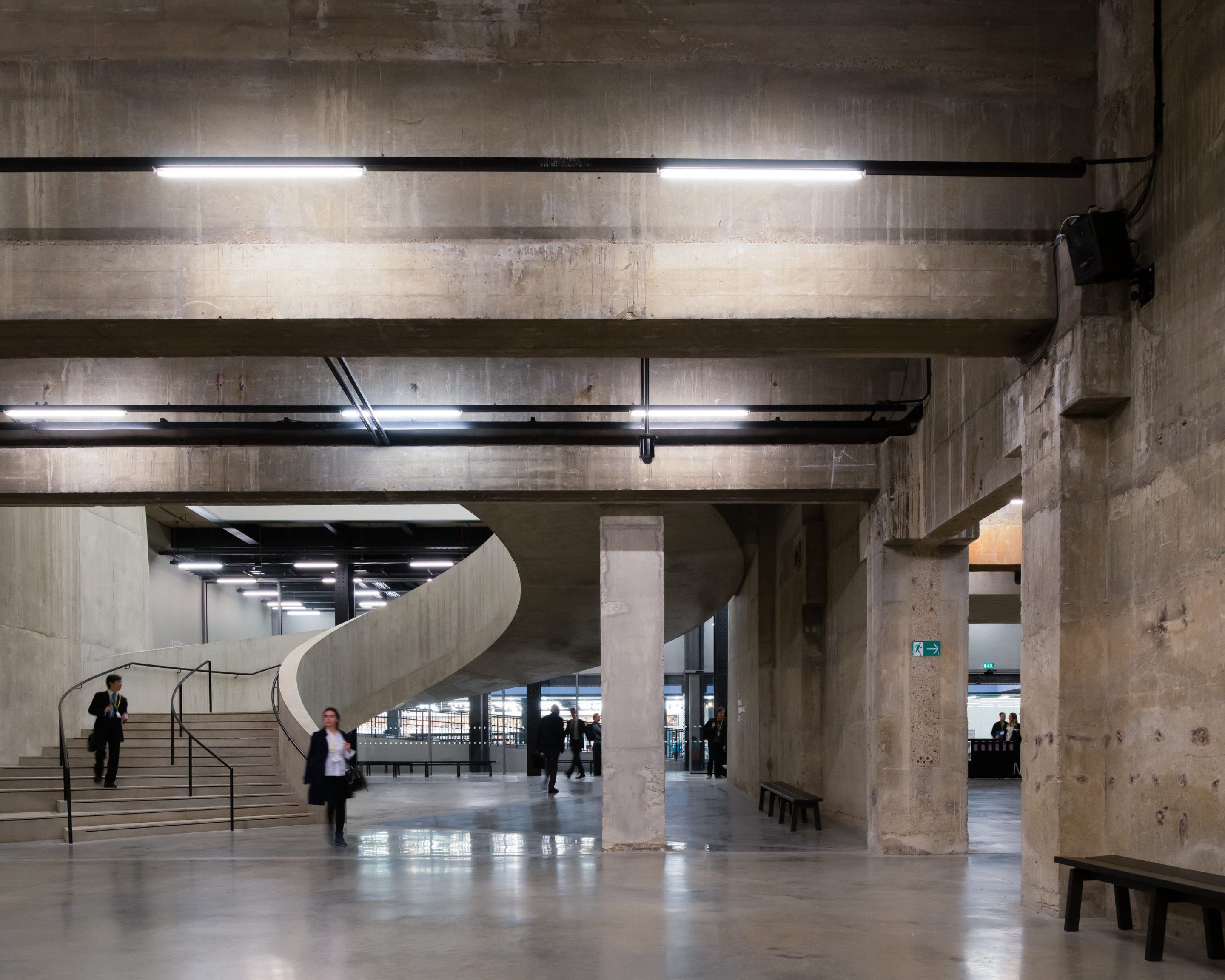 The Tate Modern by Herzog & de Meuron — The vast concrete interior of Tate Modern's public hall demonstrates Herzog & de Meuron's restrained approach to adaptive reuse.