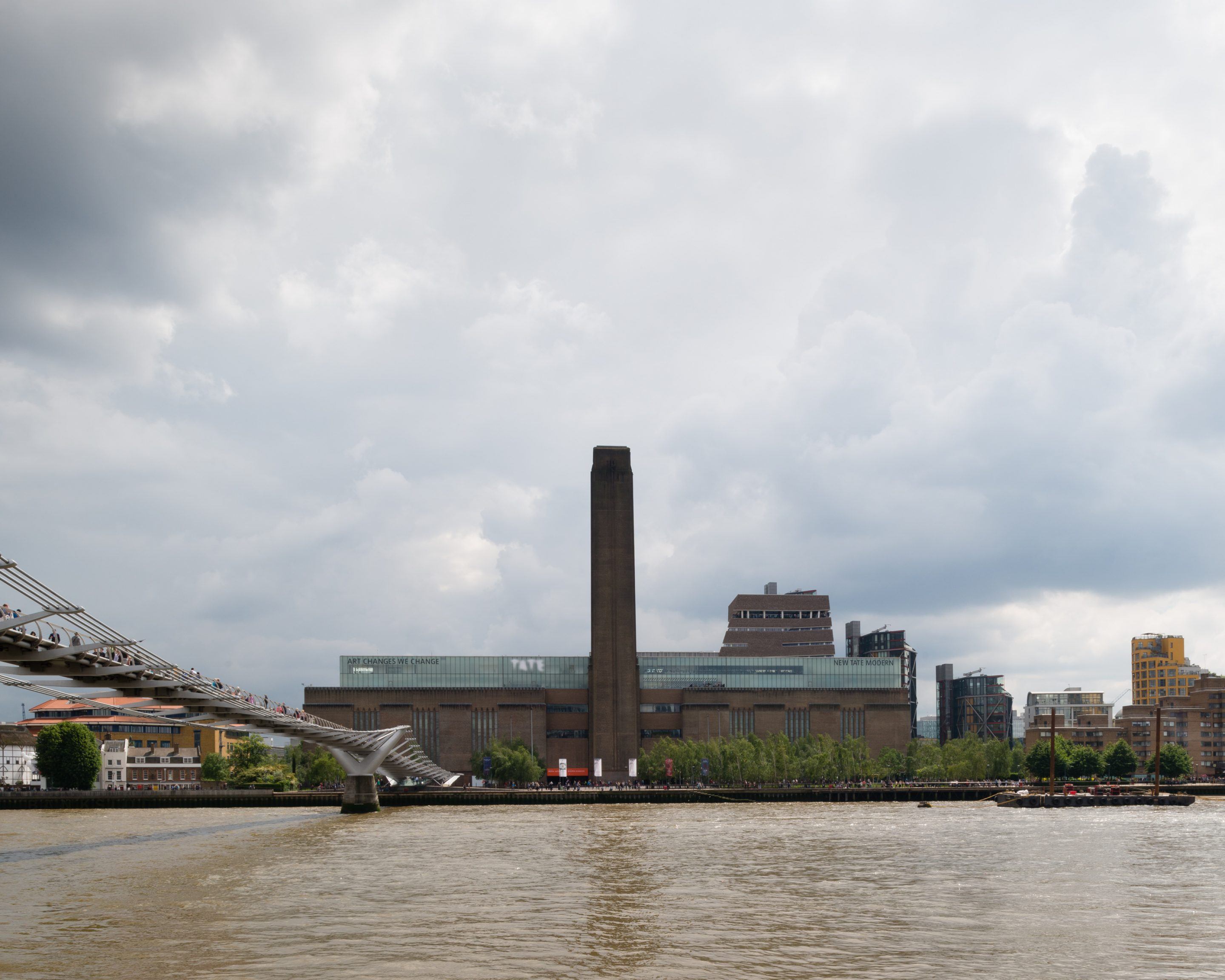 The Tate Modern by Herzog & de Meuron — The Bankside Power Station's monolithic brick mass dominates the composition, its textured surface articulated by tight diagonal weave patterns and...