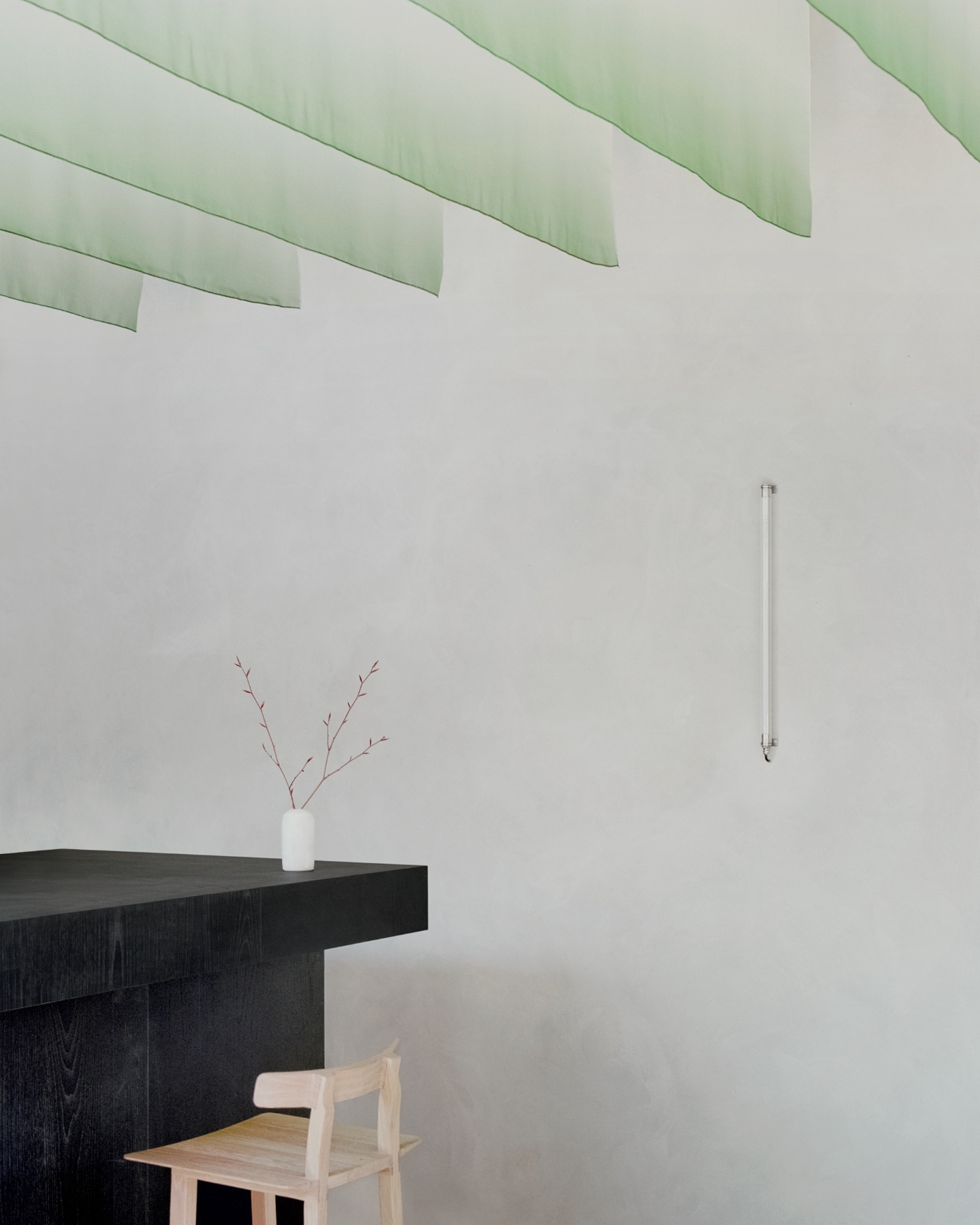 PAN Milano by studio wok — A threshold moment within PAN Milano's interior, where minimalist restraint frames essential elements.