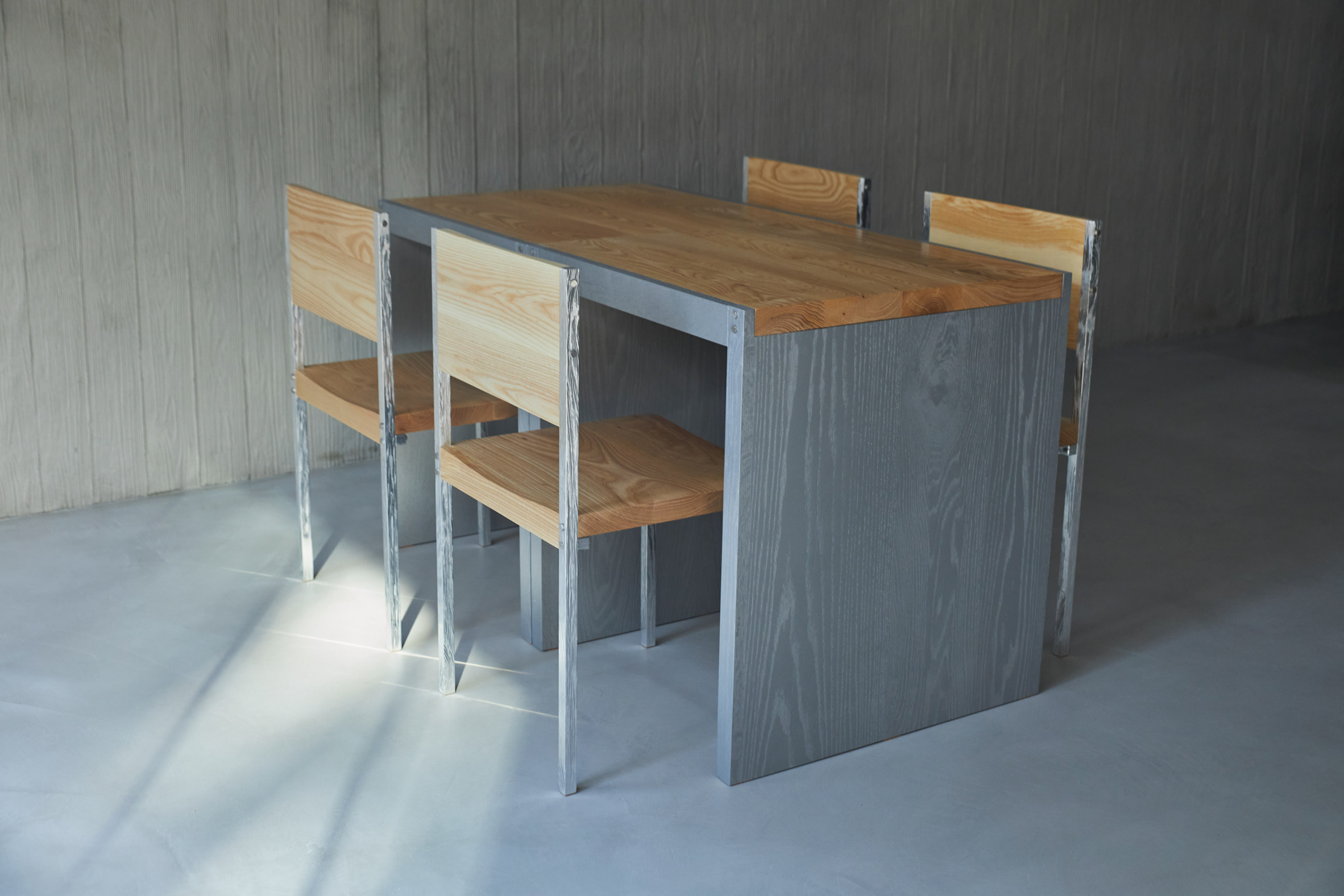 HAHOUSE Cafe by Niceworkshop — A dining ensemble at HAHOUSE Cafe demonstrates material layering through a custom table and chair set.