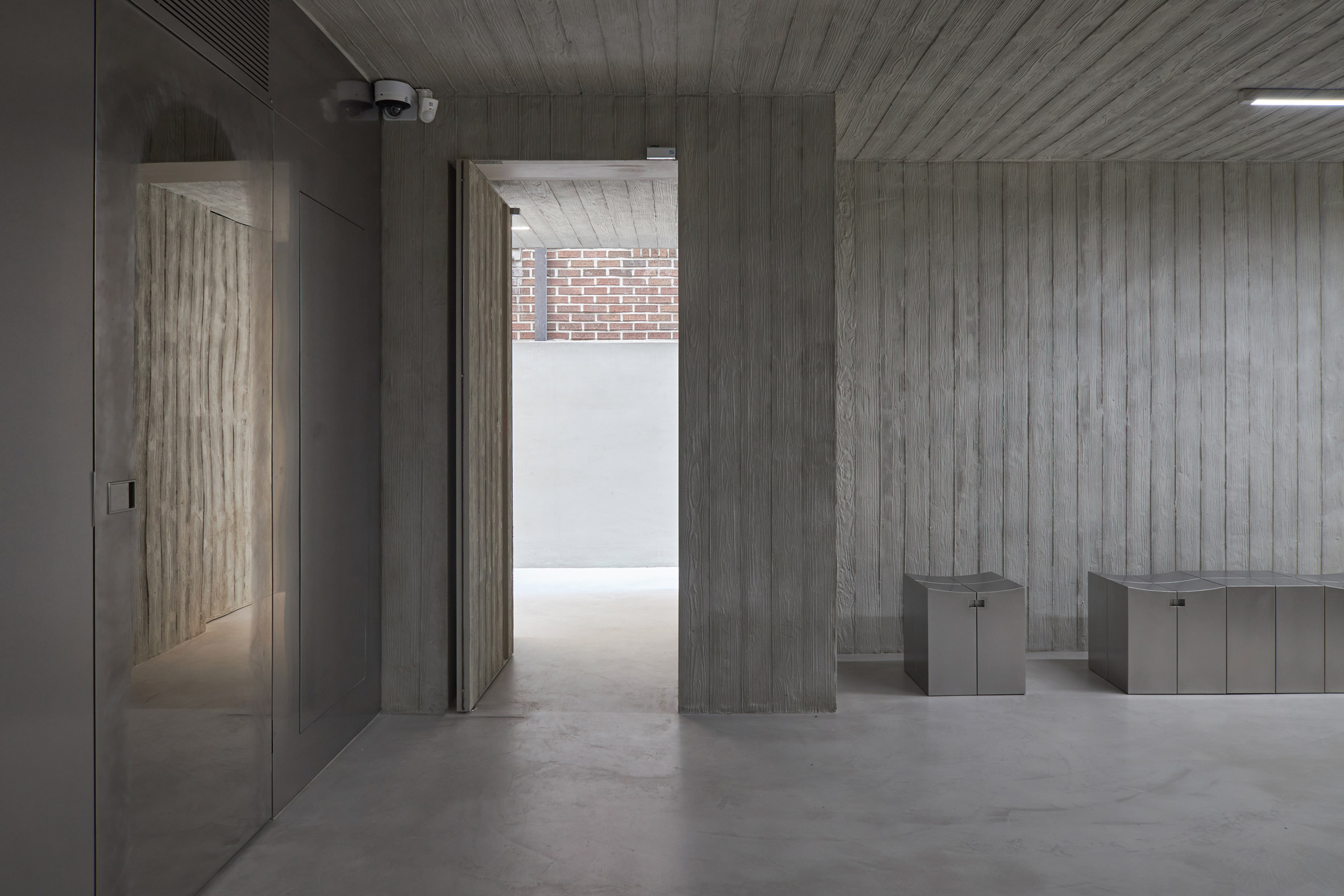 HAHOUSE Cafe by Niceworkshop — The cafe entrance establishes a material hierarchy through visible construction logic.