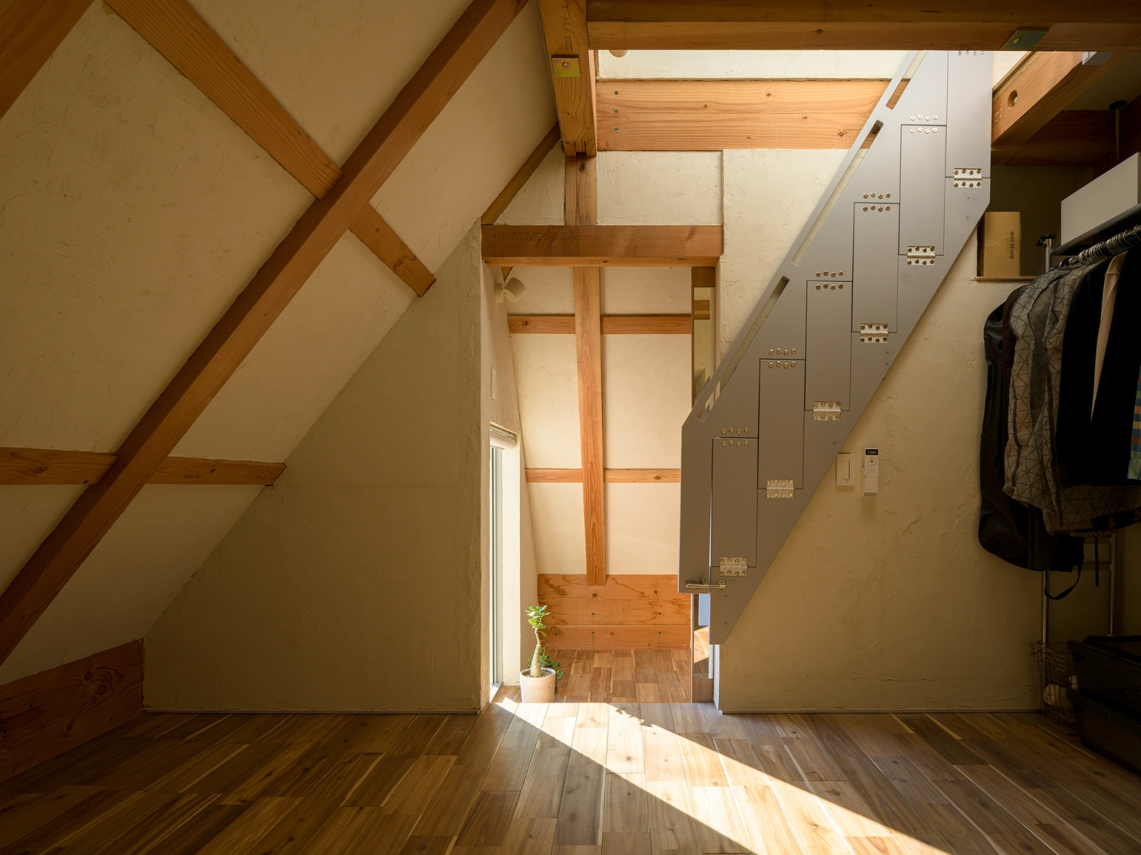 Small House on a Corner Lot by KOMINORU Design — Interior view of the upper floor reveals the spatial economy of this 30-square-meter Tokyo residence.