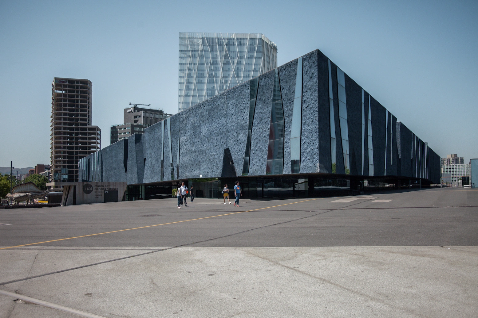 Museu Blau by Herzog & de Meuron — Denis Esakov's photograph captures the Museu Blau's massive triangular form from ground level, emphasizing its monumentality against the Barcelona skyline.