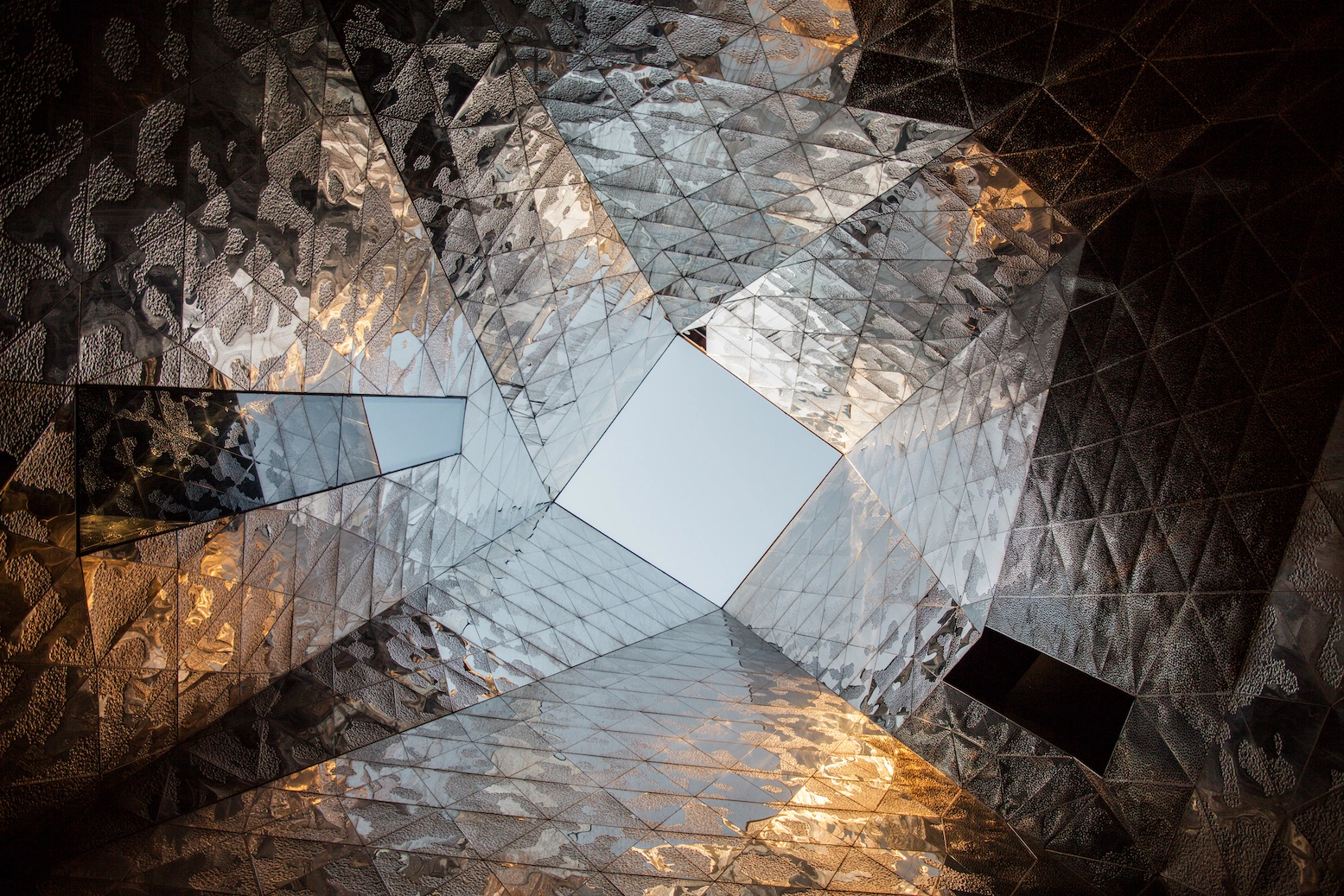 Museu Blau by Herzog & de Meuron — Esakov's overhead perspective captures the nested geometry of Museu Blau's concrete framework receding toward clear sky.