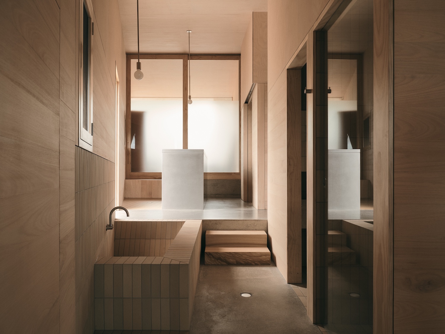 Mapleton House by Atelier Chen Hung — This passage connects the house's primary lived spaces through a linear procession.