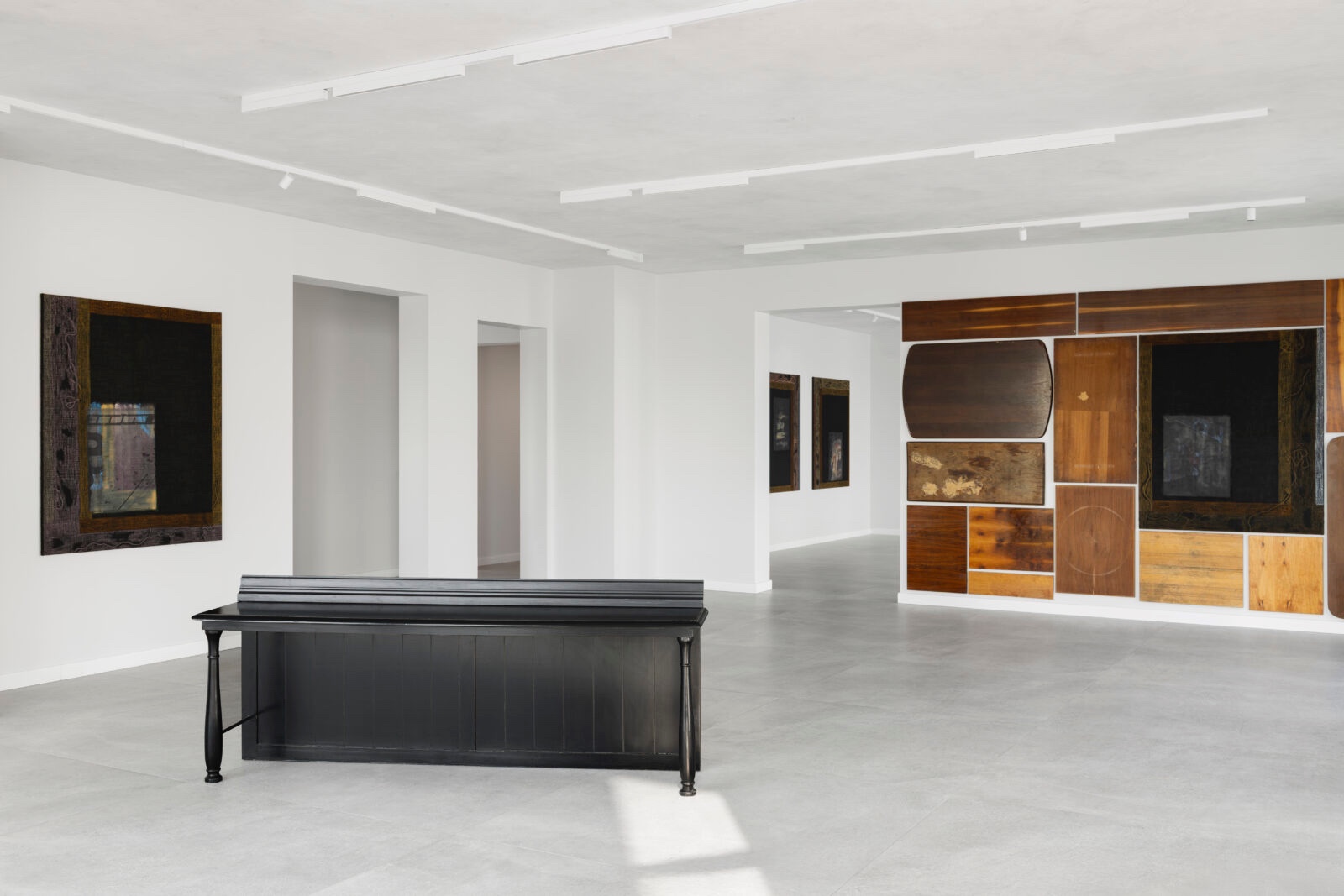 What You See is Not Here Tomorrow by Radek Brousil at Krupa Gallery — Radek Brousil's installation unfolds across the London gallery's light concrete floor beneath linear ceiling lights.