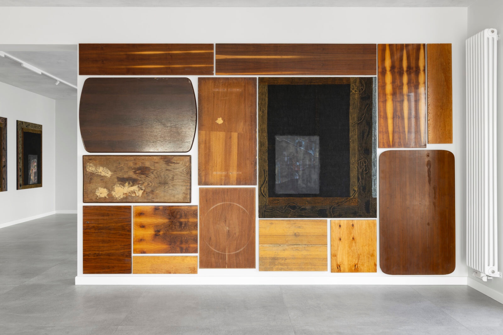 What You See is Not Here Tomorrow by Radek Brousil at Krupa Gallery — Radek Brousil's installation stages wooden architectural fragments and furnishings as a temporal collage across a gallery wall.