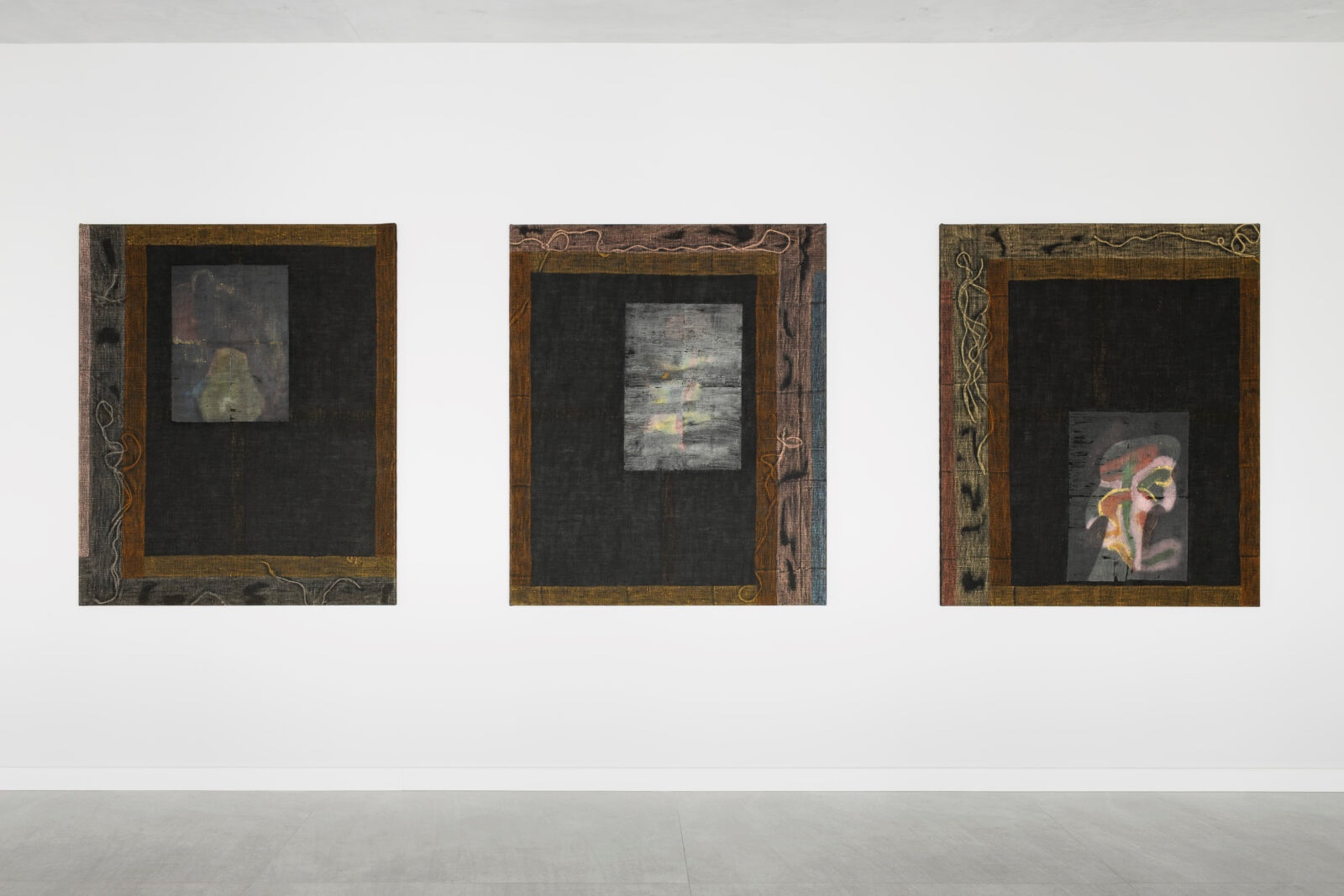 What You See is Not Here Tomorrow by Radek Brousil at Krupa Gallery — Three framed works mounted at equal intervals across a white gallery wall, each featuring a wooden border with dark matting and a recessed central image.