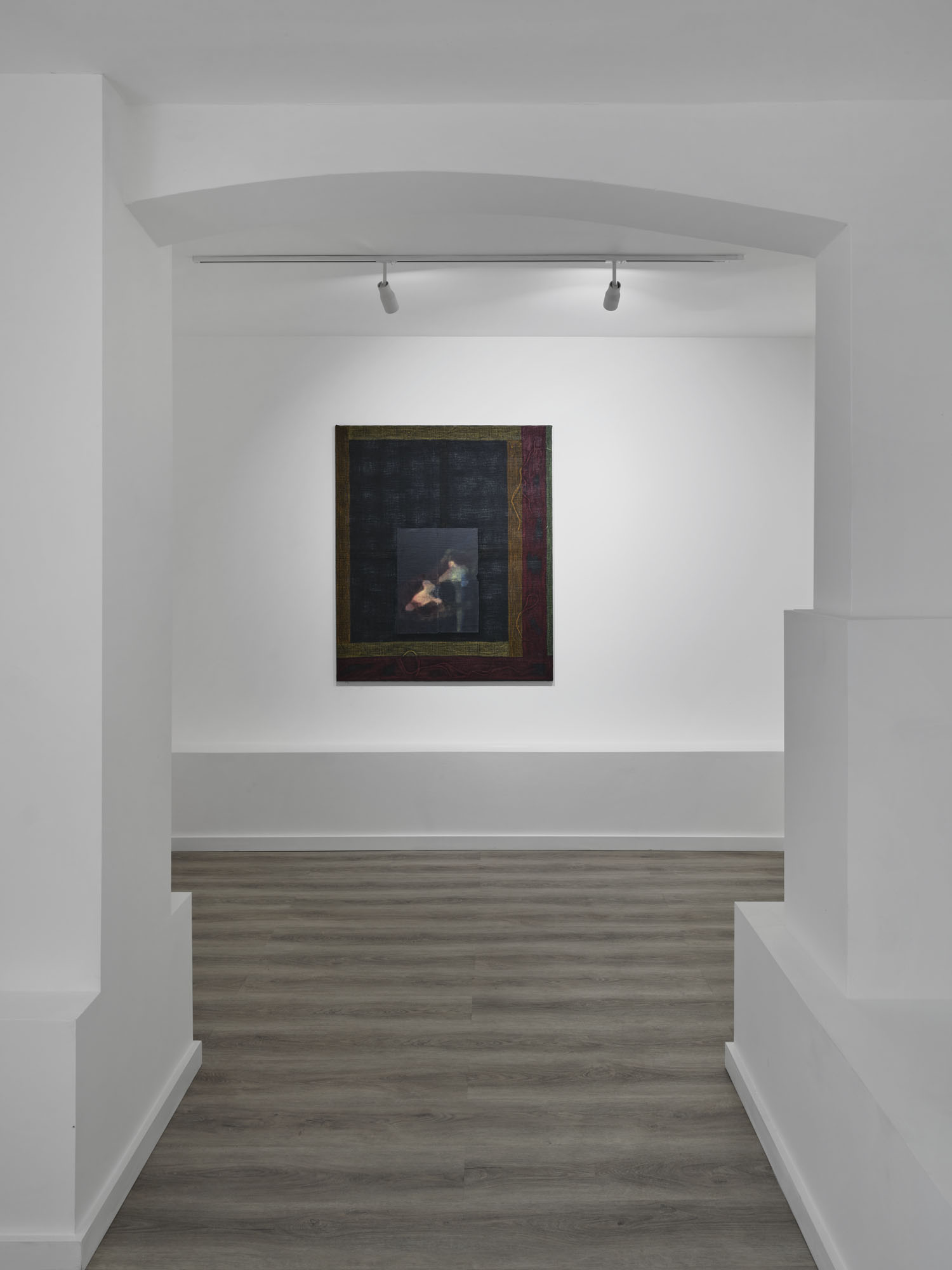 What You See is Not Here Tomorrow by Radek Brousil at Krupa Gallery — A framed artwork with wooden border and dark matting is wall-mounted in a recessed gallery alcove, its cream and blue-toned figurative form barely...