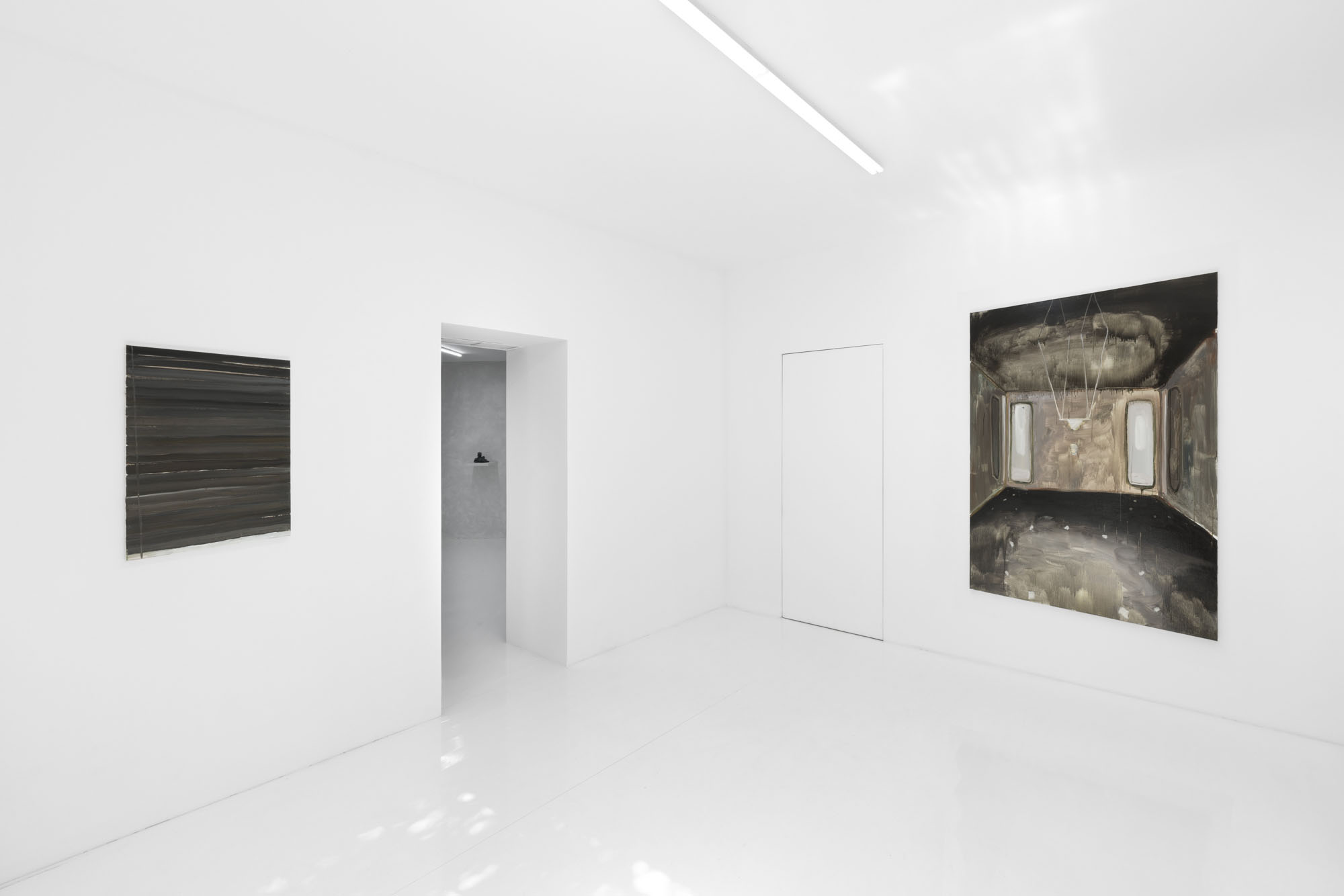Four Minutes After Sunset by Rudy Cremonini at Capsule Shanghai — The gallery interior presents a sparse, axial composition anchored by a white cylindrical plinth positioned centrally in the sightline.