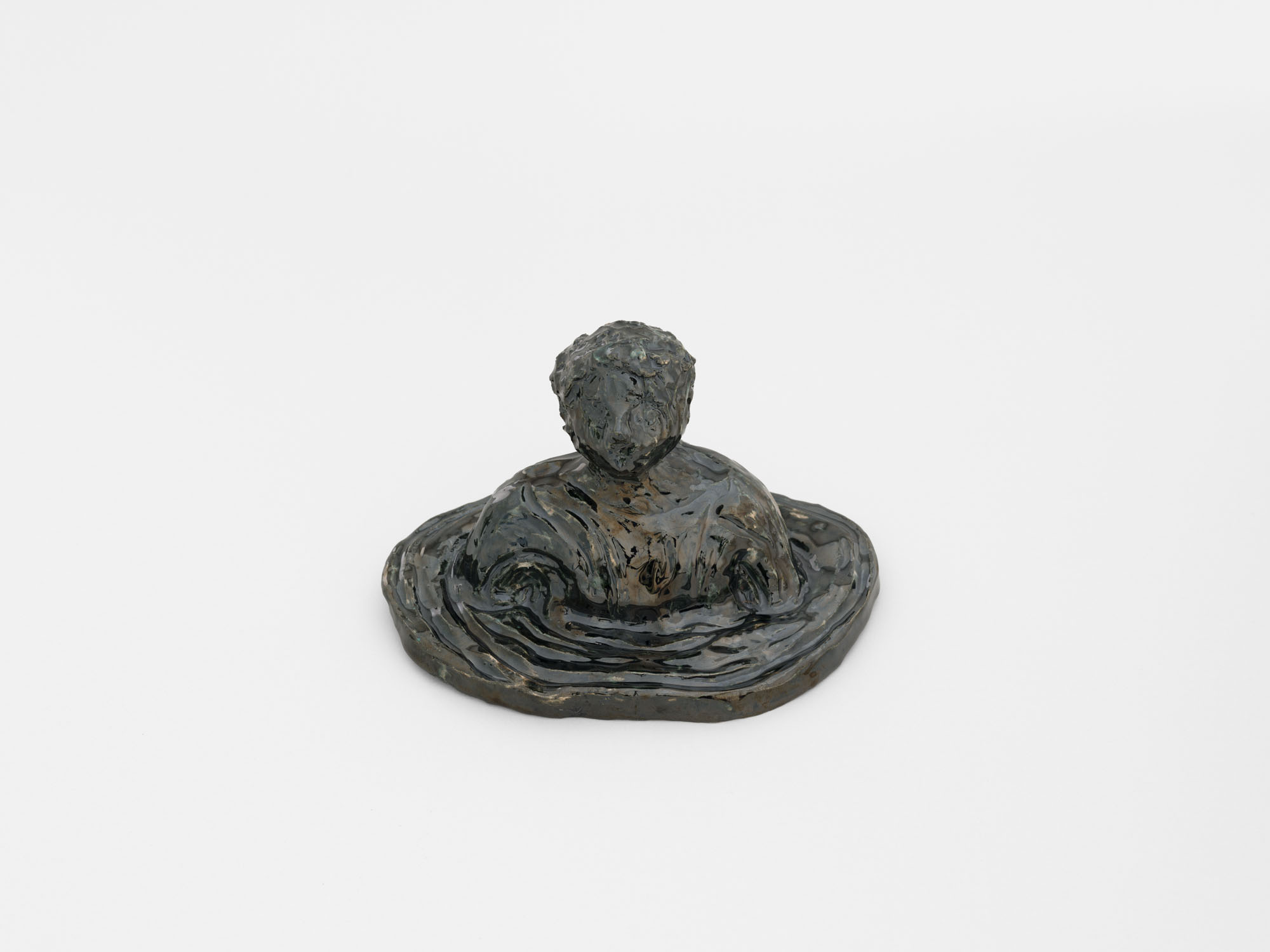 Four Minutes After Sunset by Rudy Cremonini at Capsule Shanghai — A patinated bronze sculptural bust mounted on a wide, circular plinth dominates the composition.