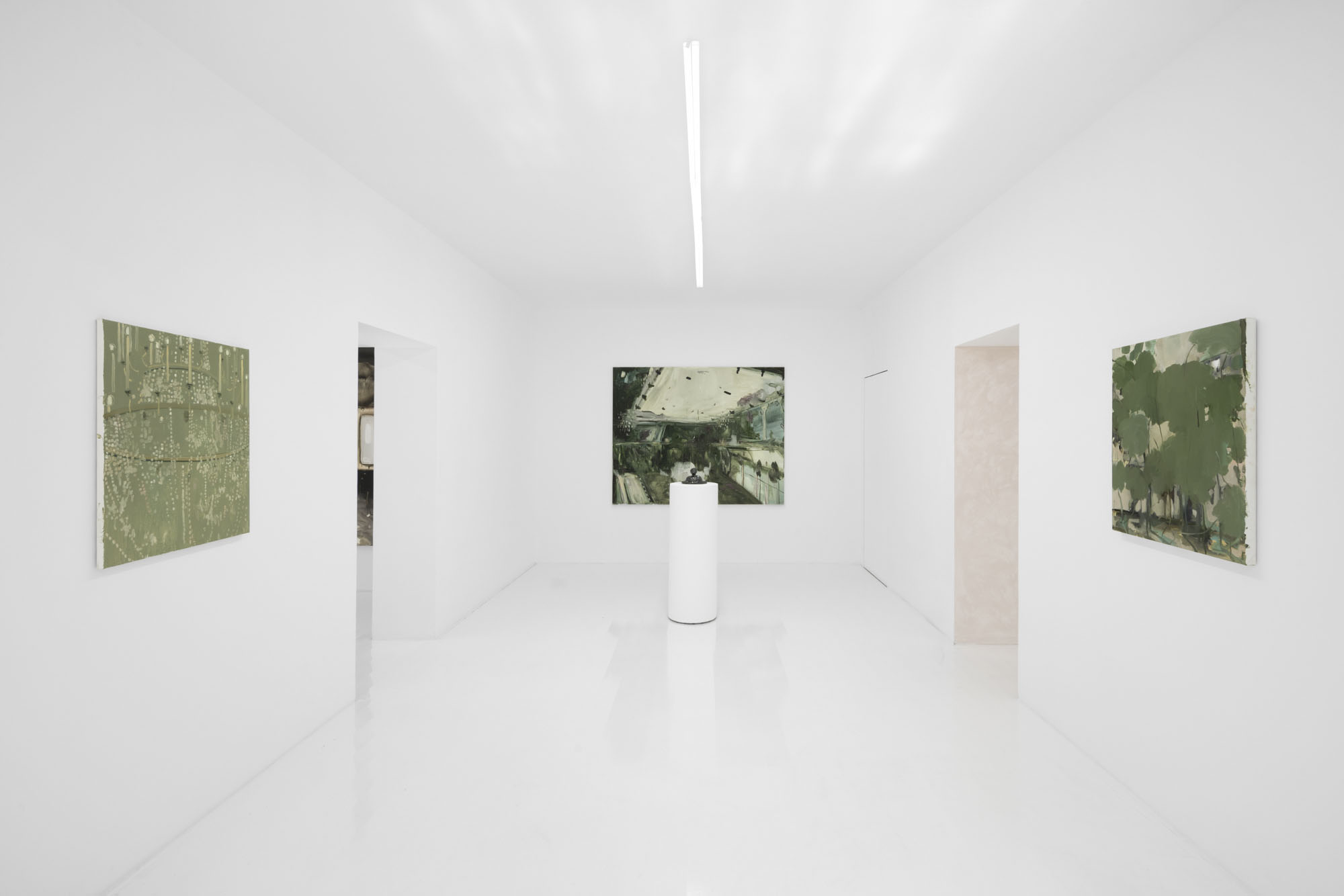 Four Minutes After Sunset by Rudy Cremonini at Capsule Shanghai — A single photograph mounted at eye level on a white cylindrical plinth anchors the gallery's central axis.