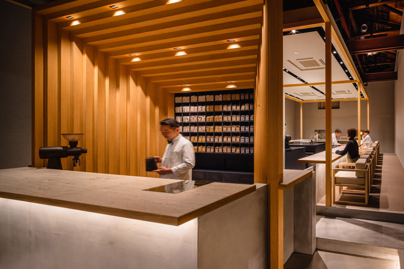 Koffee Mameya Kakeru by Fourteen Stones Design — The storefront presents a transparent threshold between street and interior.