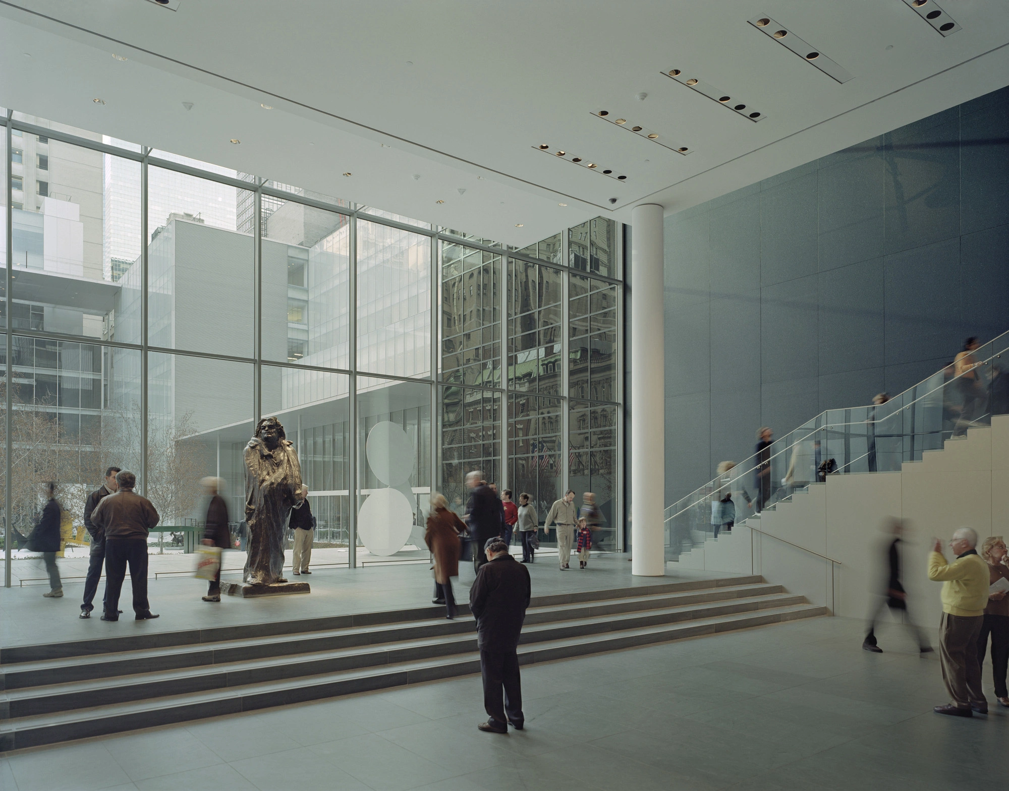 Museum of Modern Art in New York by Yoshio Taniguchi — The atrium's expansive ground plane demonstrates Taniguchi's spatial clarity through a rectilinear composition.