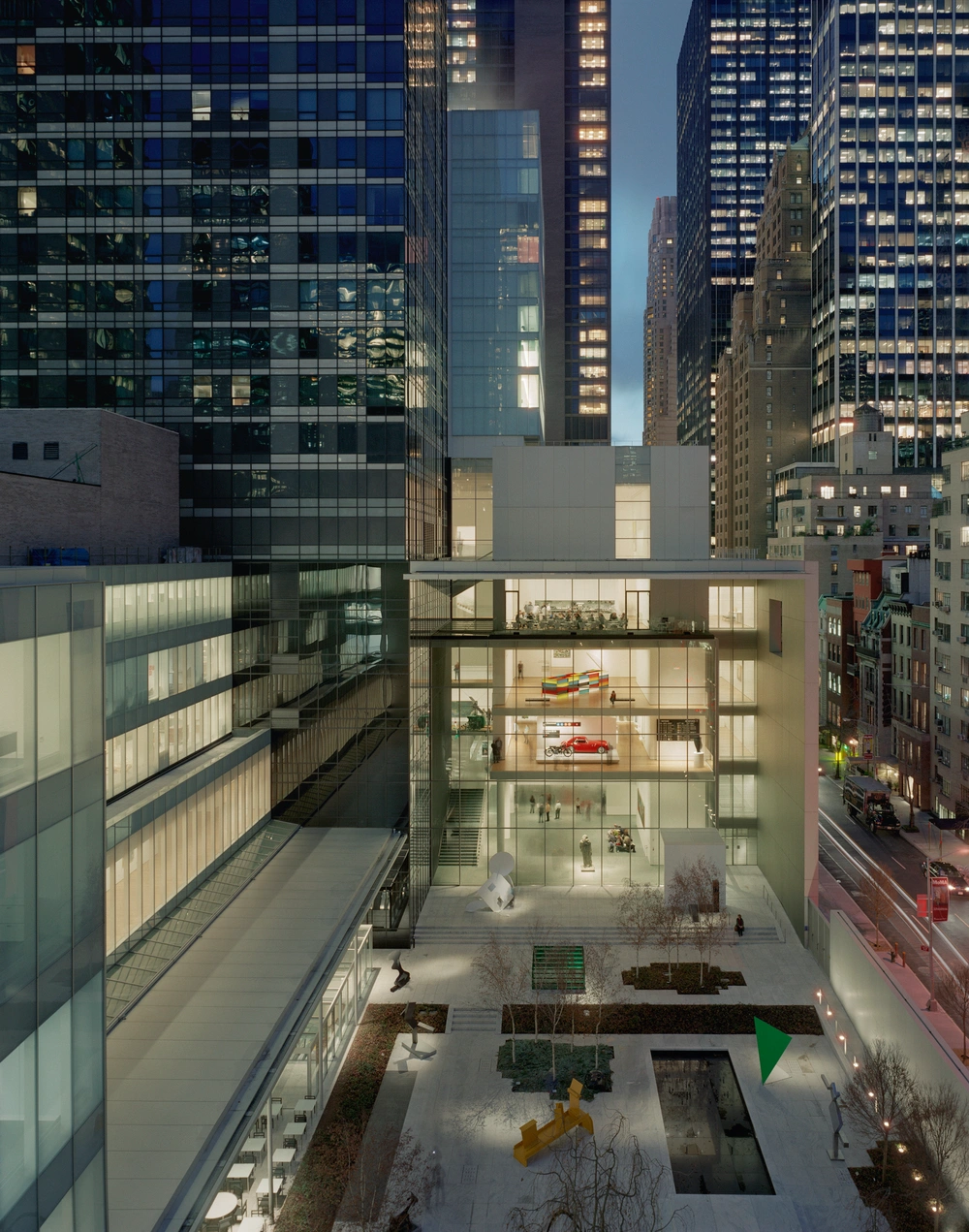 Museum of Modern Art in New York by Yoshio Taniguchi — Aerial perspective of MoMA's ground-level courtyard and interior galleries, photographed during daylight.