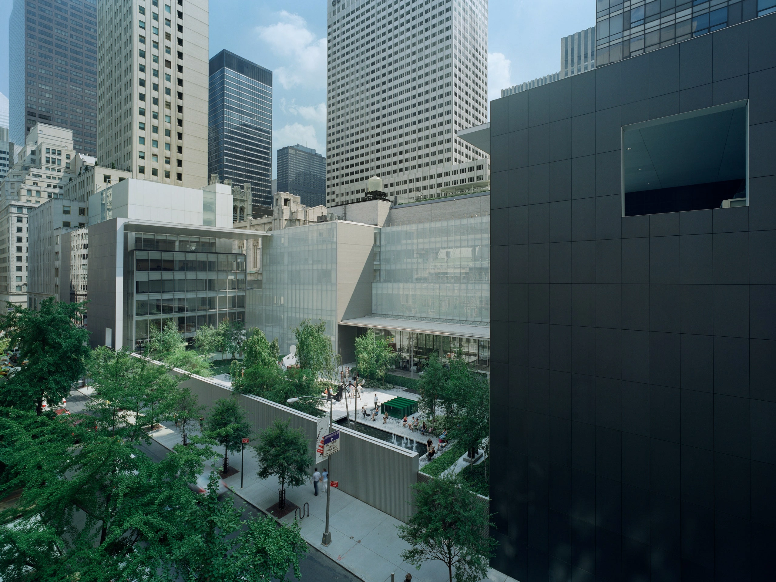 Museum of Modern Art in New York by Yoshio Taniguchi — Aerial view of the MoMA expansion courtyard revealing the architectural strategy of horizontal layering and material restraint.