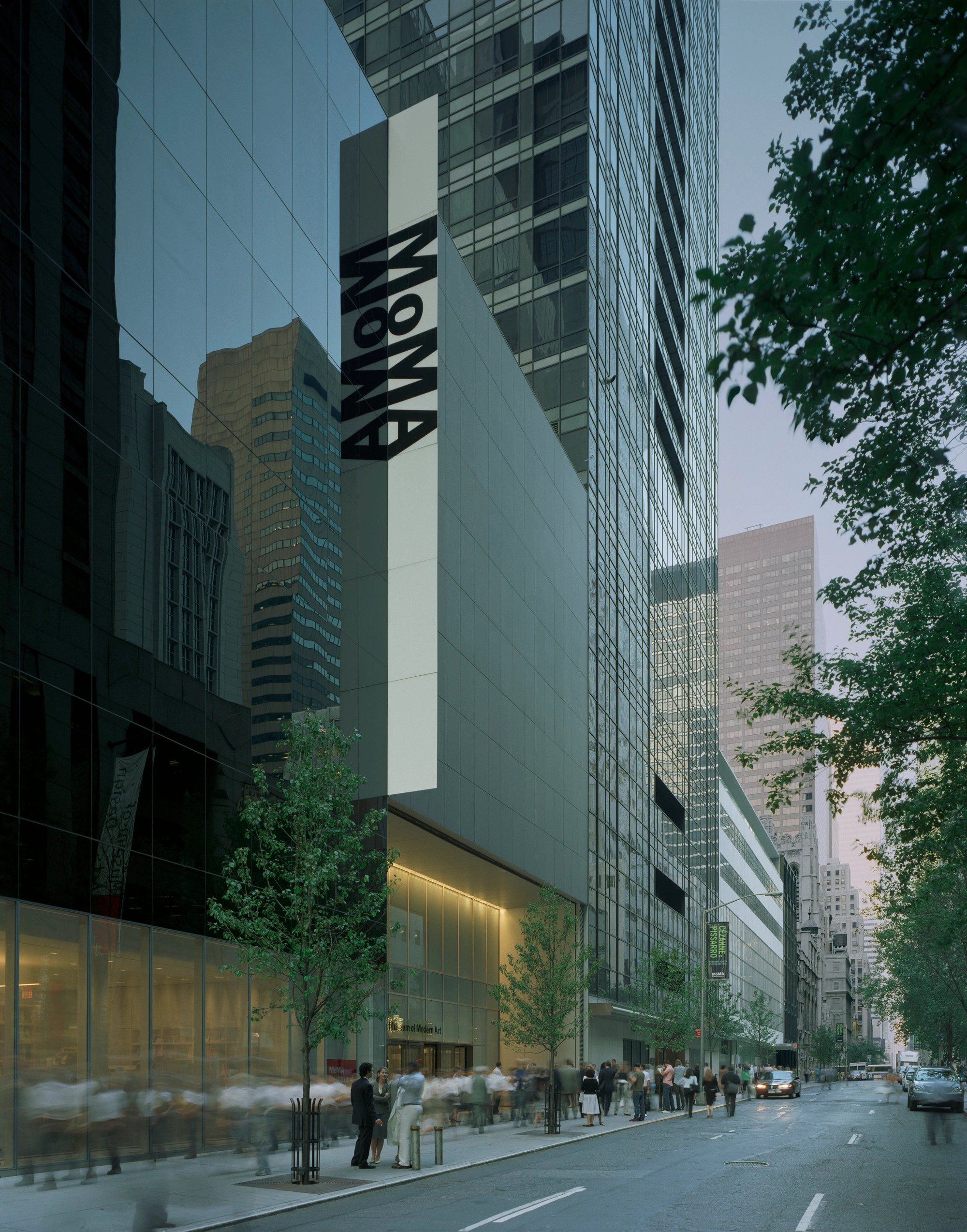 Museum of Modern Art in New York by Yoshio Taniguchi — The MoMA expansion's street-facing facade reveals Taniguchi's restrained approach through continuous white cladding panels with imperceptible joints,...