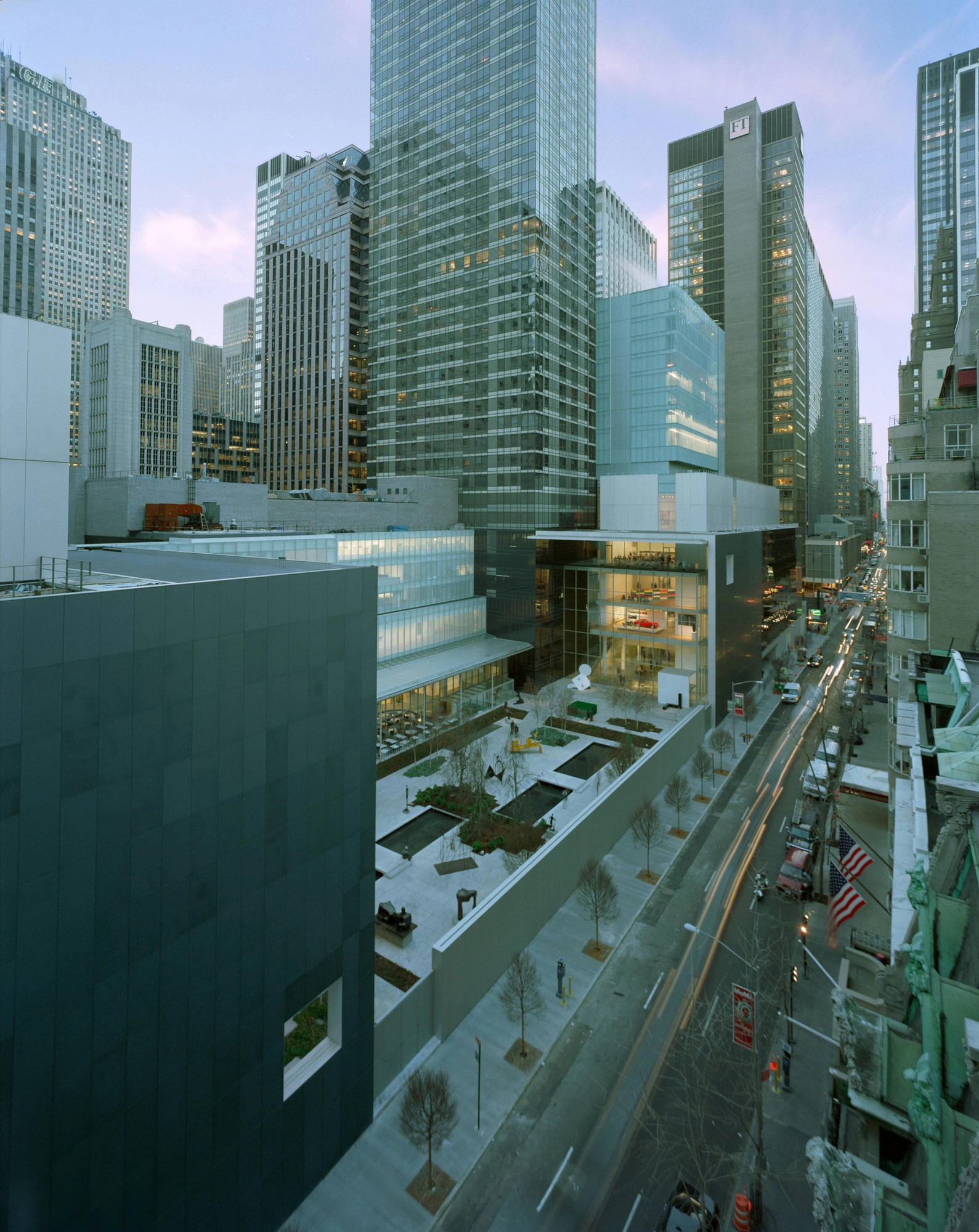 Museum of Modern Art in New York by Yoshio Taniguchi — Yoshio Taniguchi's 2004 MoMA expansion photographed at dusk, revealing the museum's street-level integration.